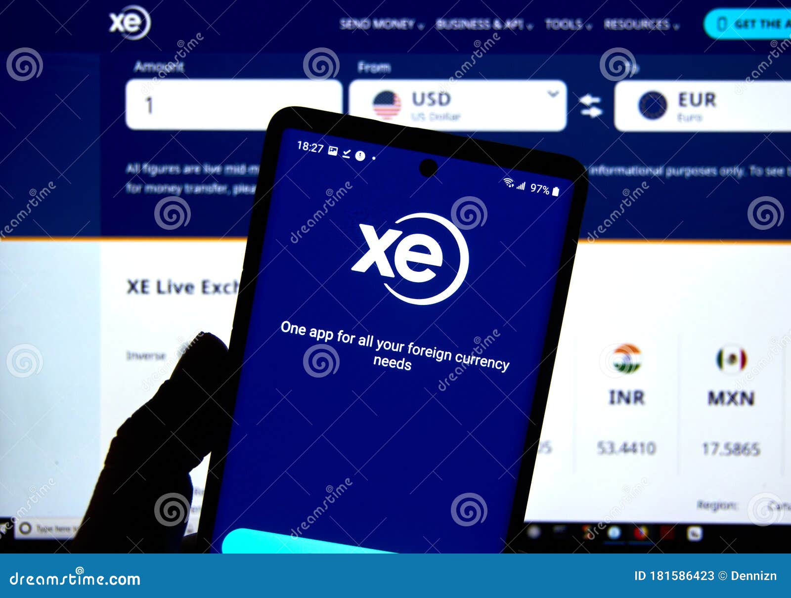 Xe.com Logo and Application on a Cell Phone Over an Official Web Site ...