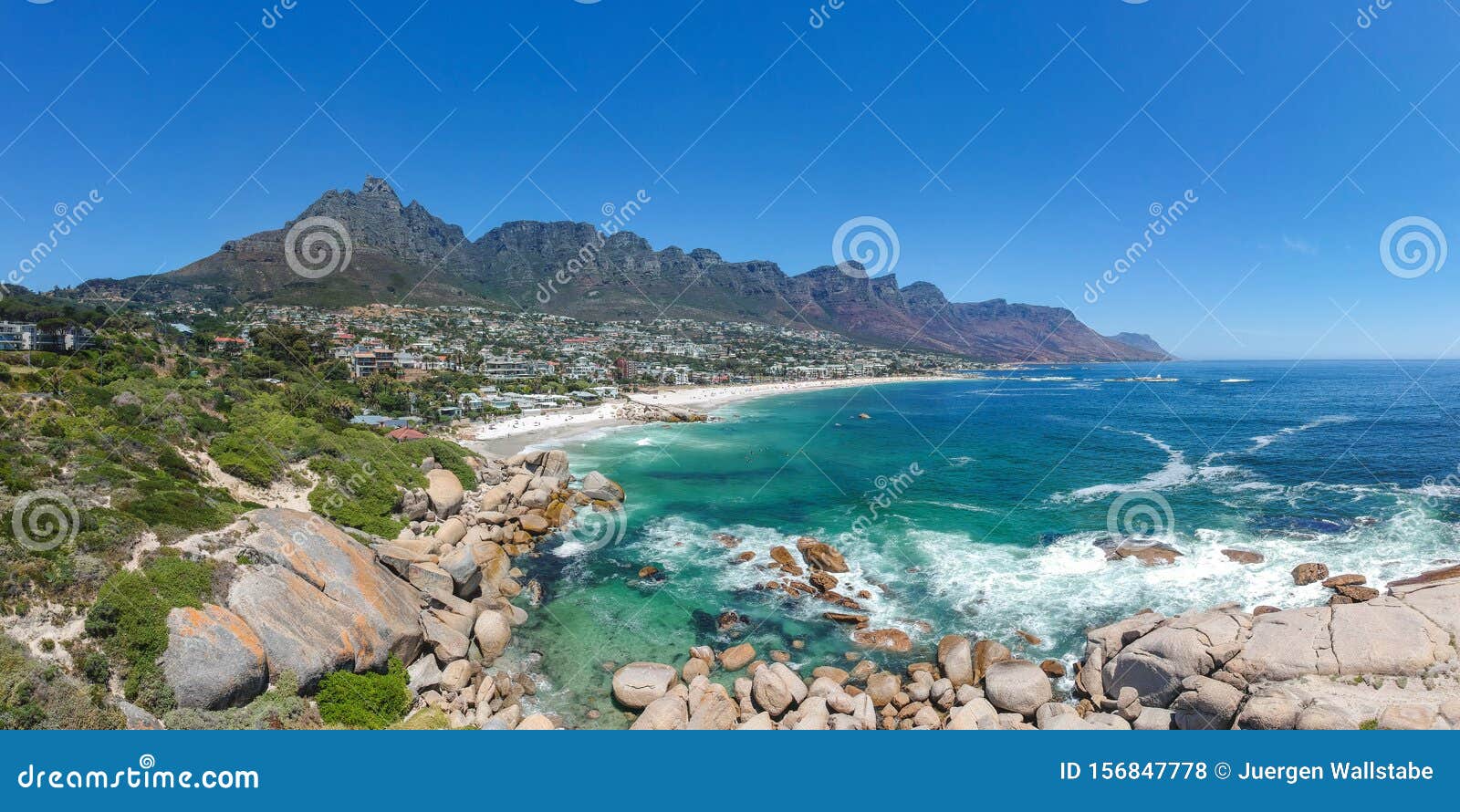 xxl aerial panoramic drone view of camps bay, an affluent suburb of cape town, south africa.