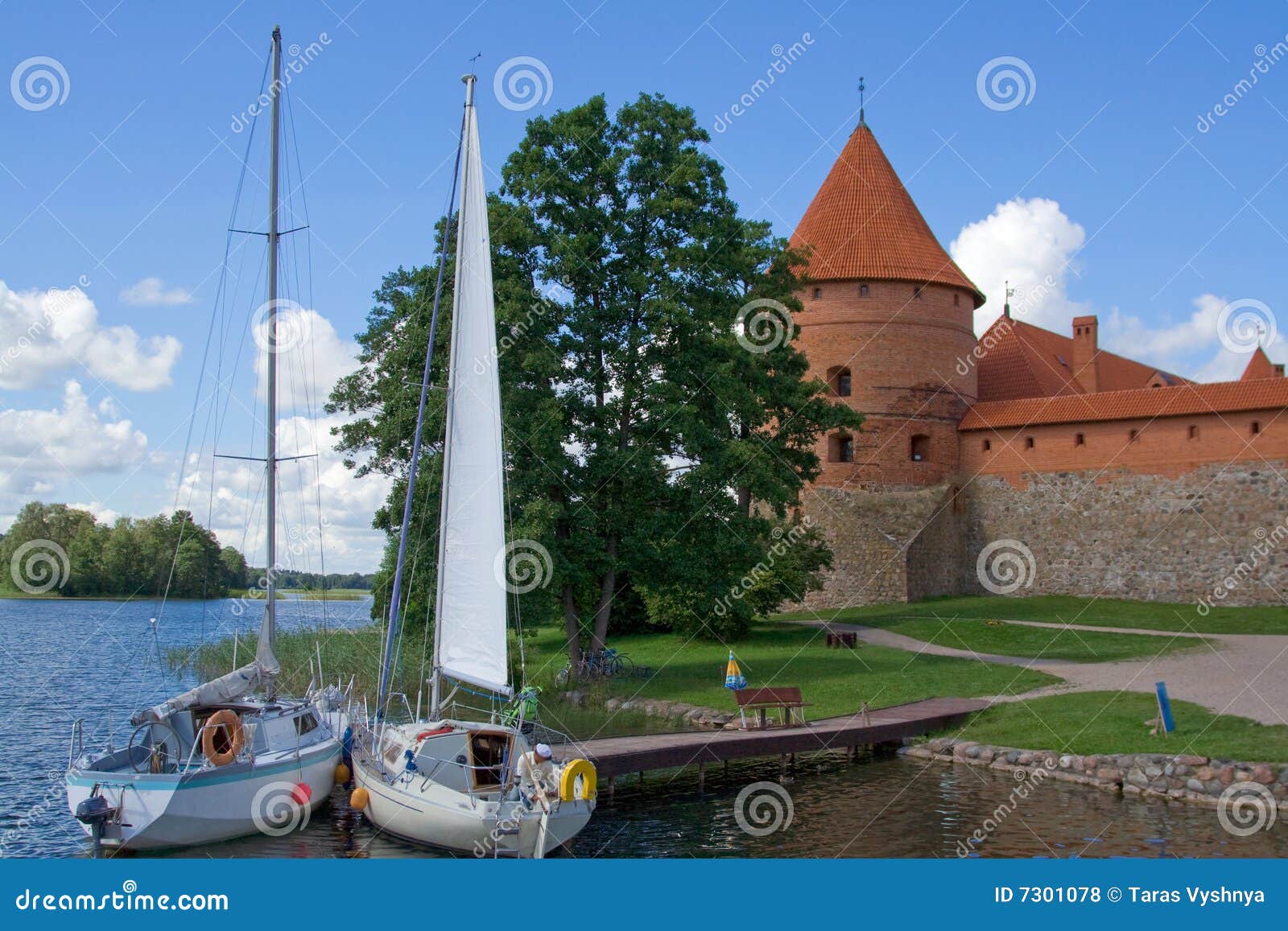 Yacht castle. Yachts parked near Mediterranean castle of red brick on lake famous tourist place trakai