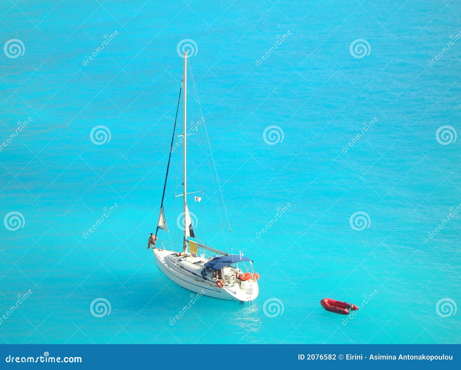 yacht in light blue ionian sea