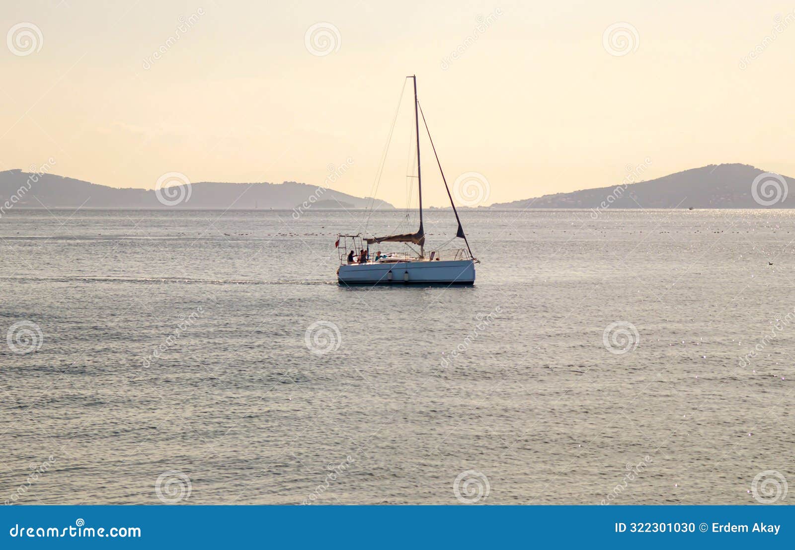 yacht sailing on the calm sea and islands view in the background