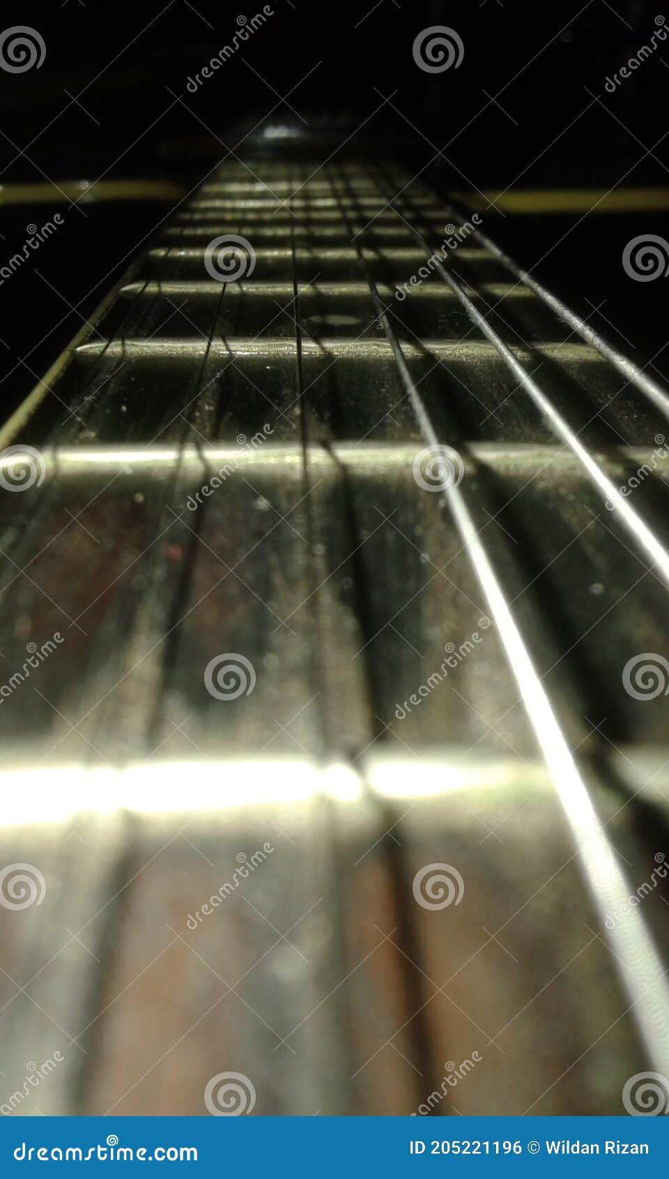 the yamaha guitar with the light on the darkness