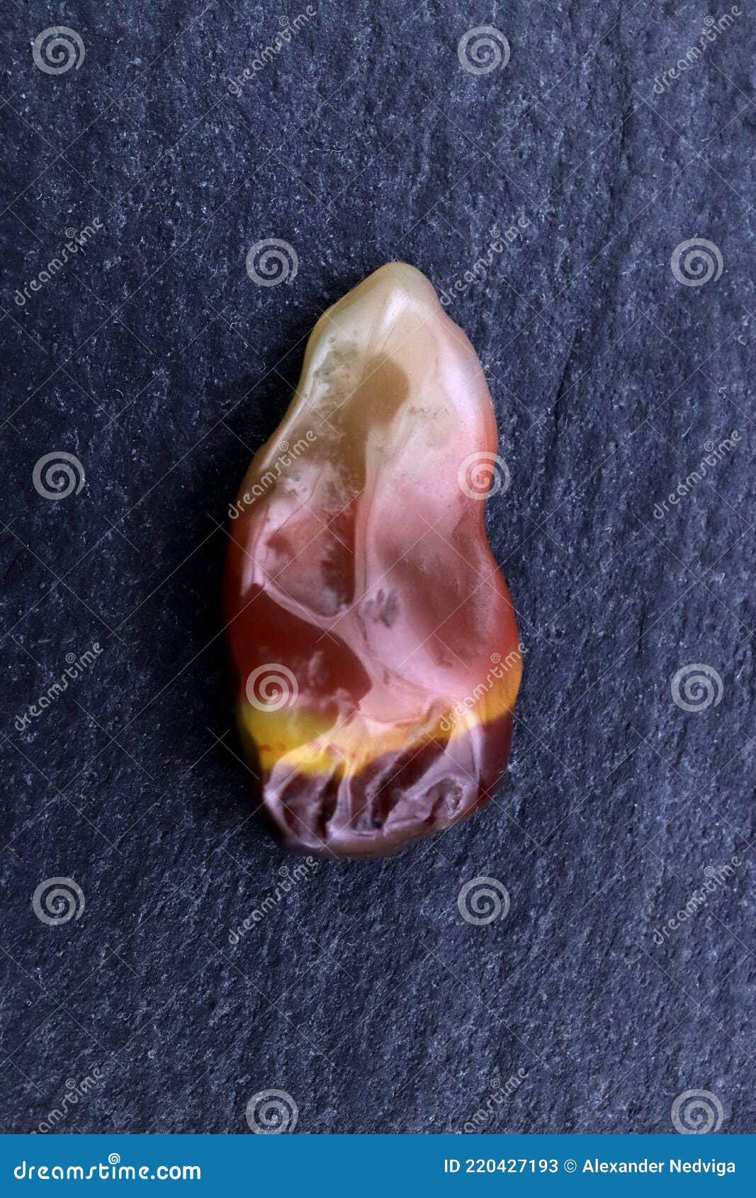 yanyuan agate stone texture on black stone background. macro closeup