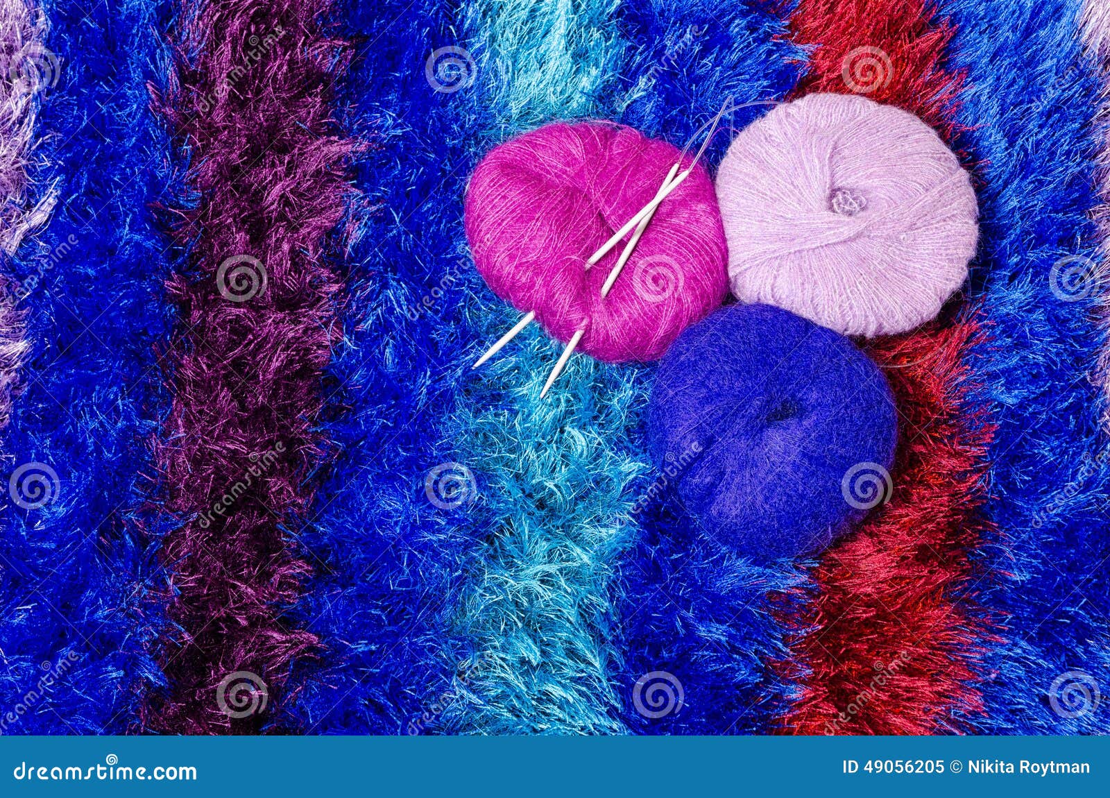 Yarn with Knitting Needles on Stripped Cloth Stock Image - Image of ...