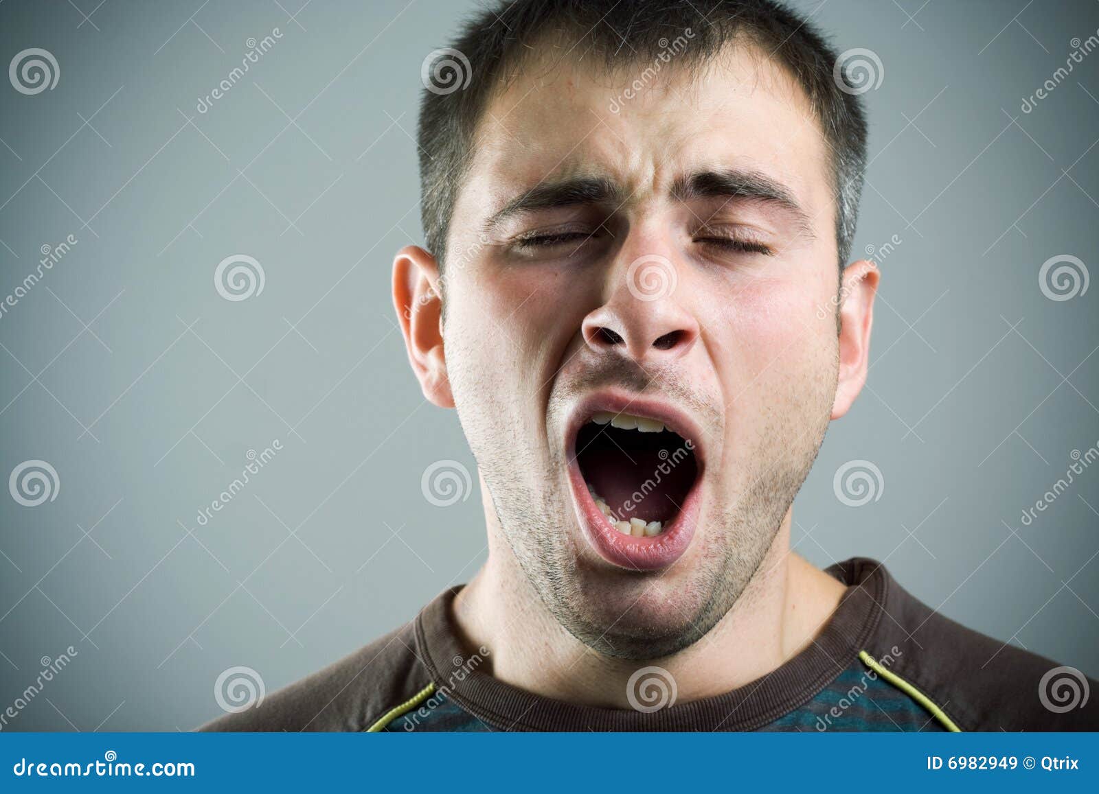 Yawning young man. stock image. Image of yawn, making 6982949
