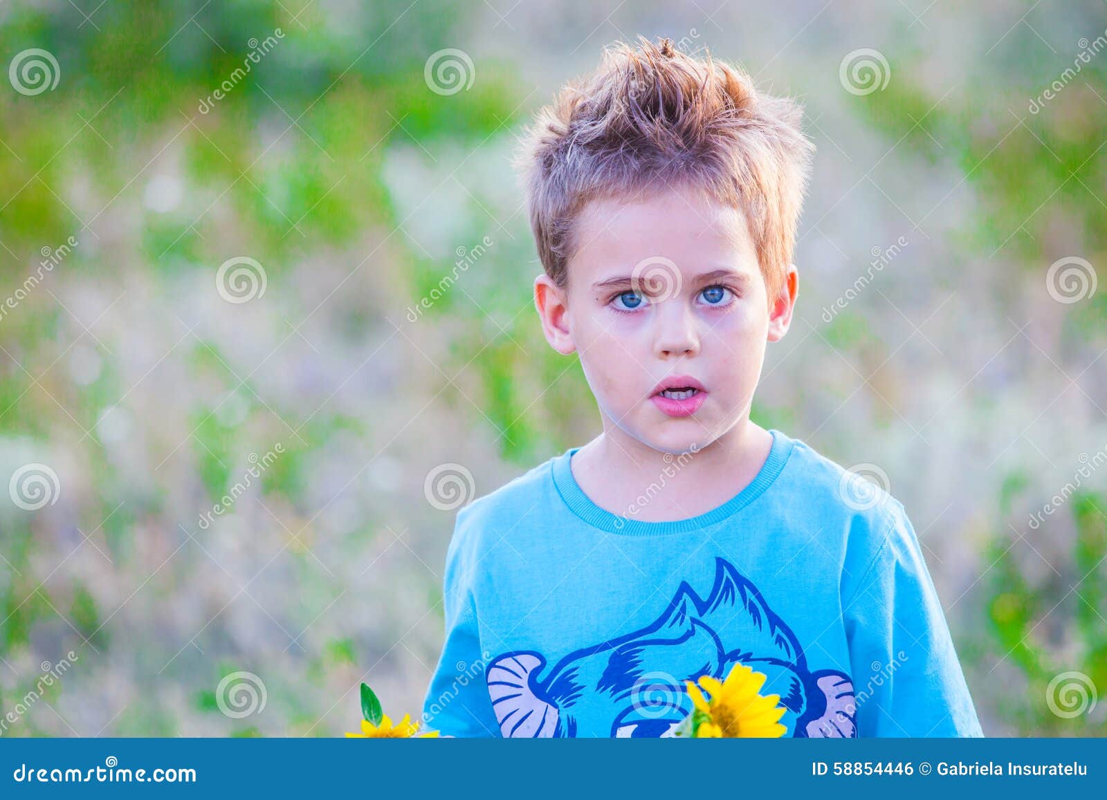 Portrait of a 5 year old boy outdoor in the countryside.