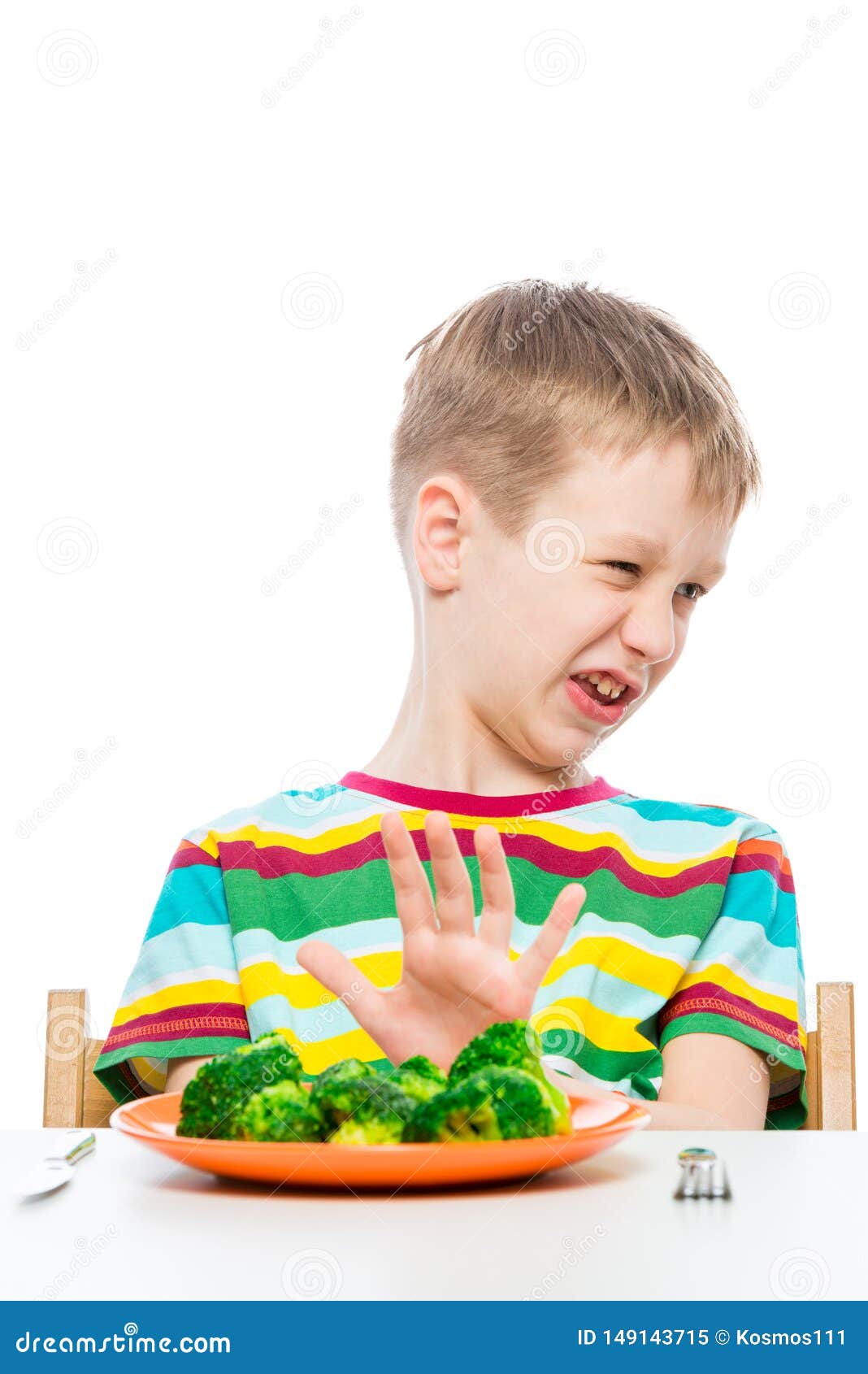 10yearold Boy Refuses a Plate of Broccoli for Lunch, Concept Photo