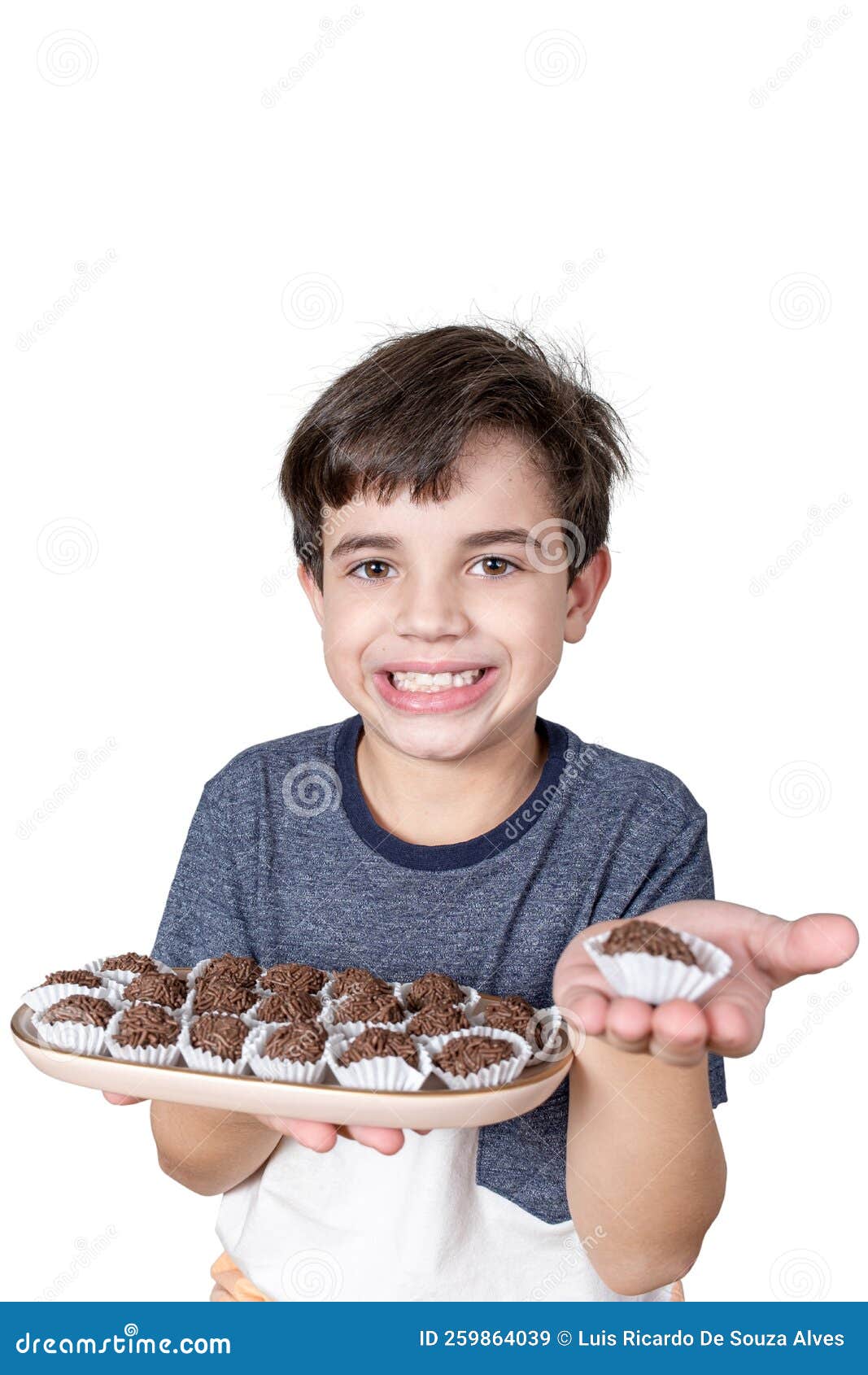 9 Year Old Brazilian Holding A Tray With Several Brazilian Fudge Balls And In The Other Hand