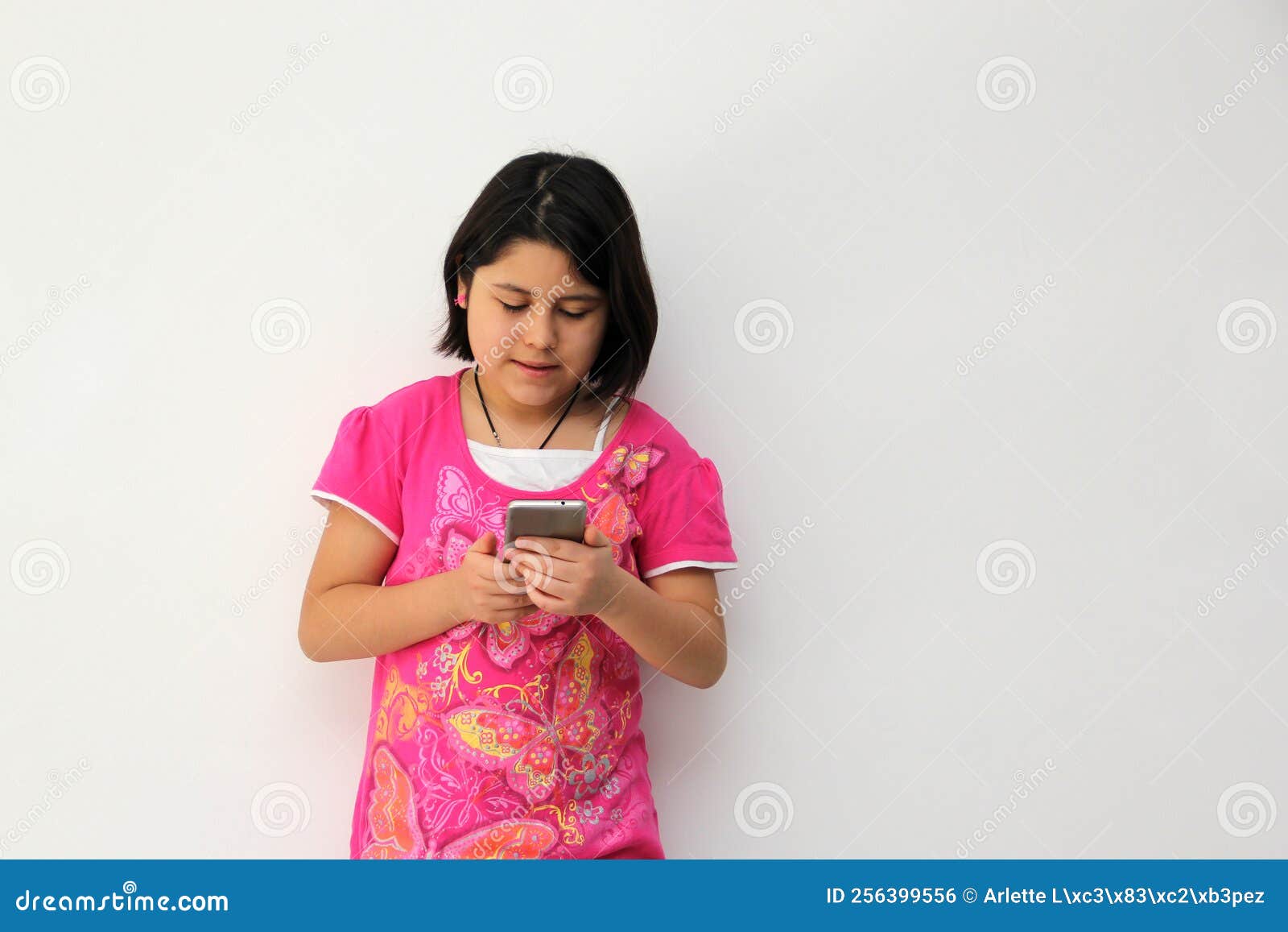 10 Year Old Hispanic Girl Uses Her Cell Phone To Make Video Calls Play Video Games Send