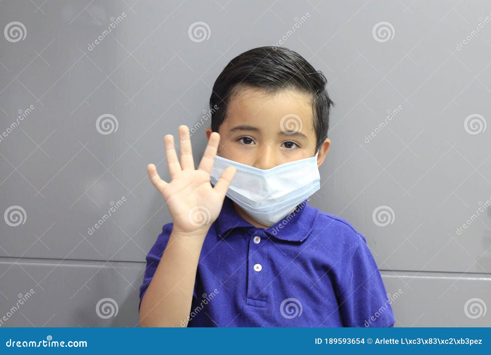 6-year-old latino boy with covid-19 prevention mask