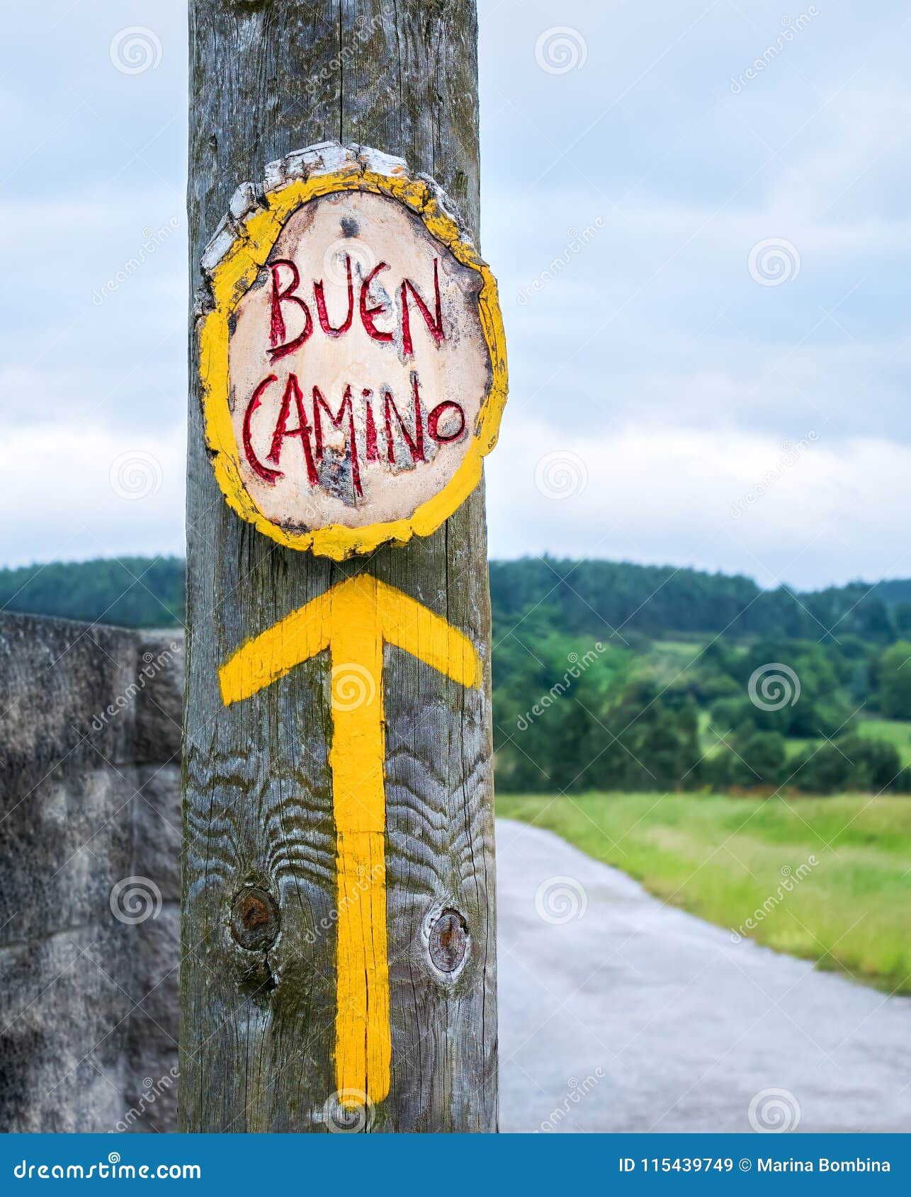 yellow arrow, sign for pilgrims on the camino de santiago in spa