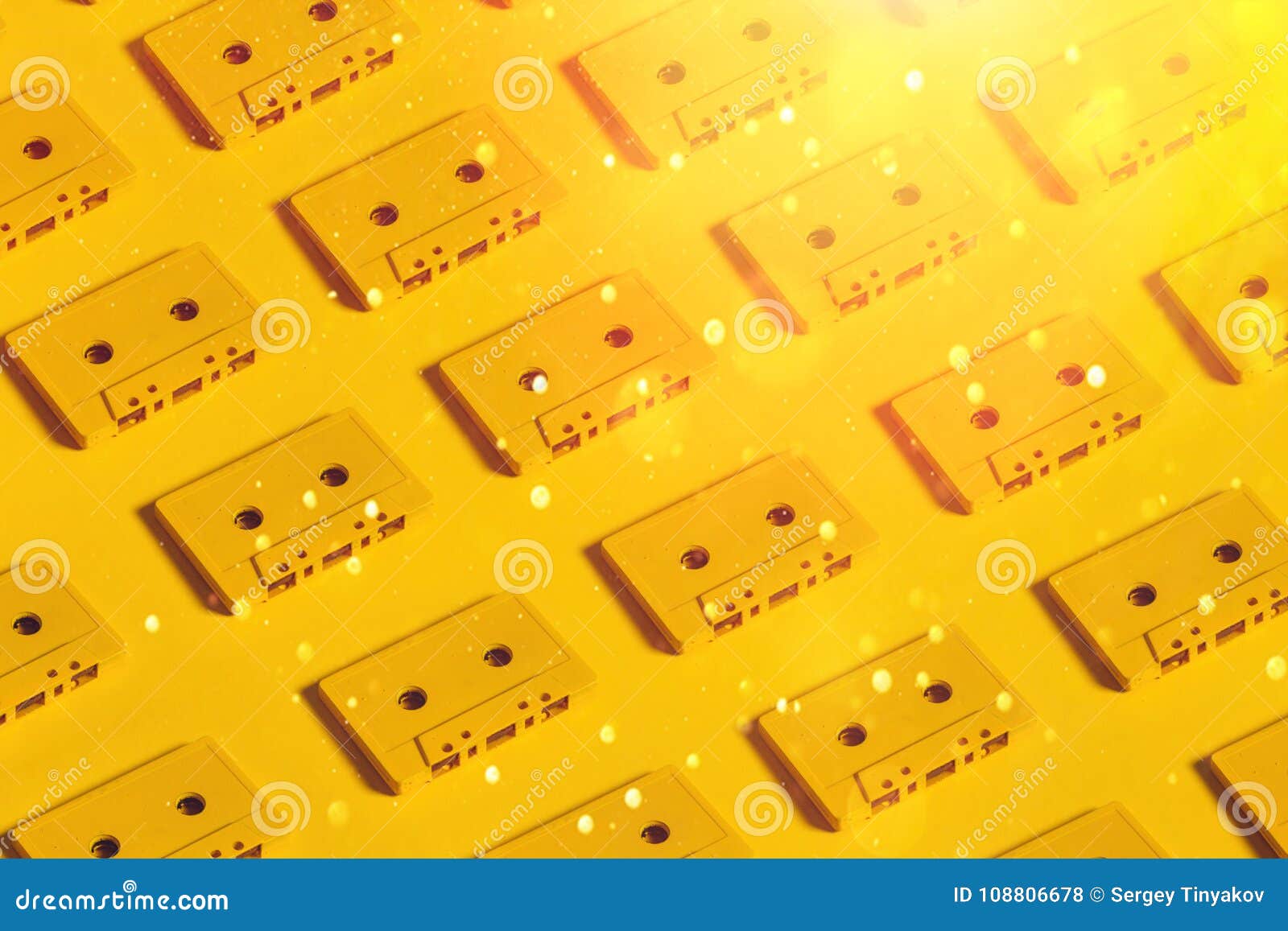 Yellow Audio Cassette Tapes on Yellow Background. Creative Concept of