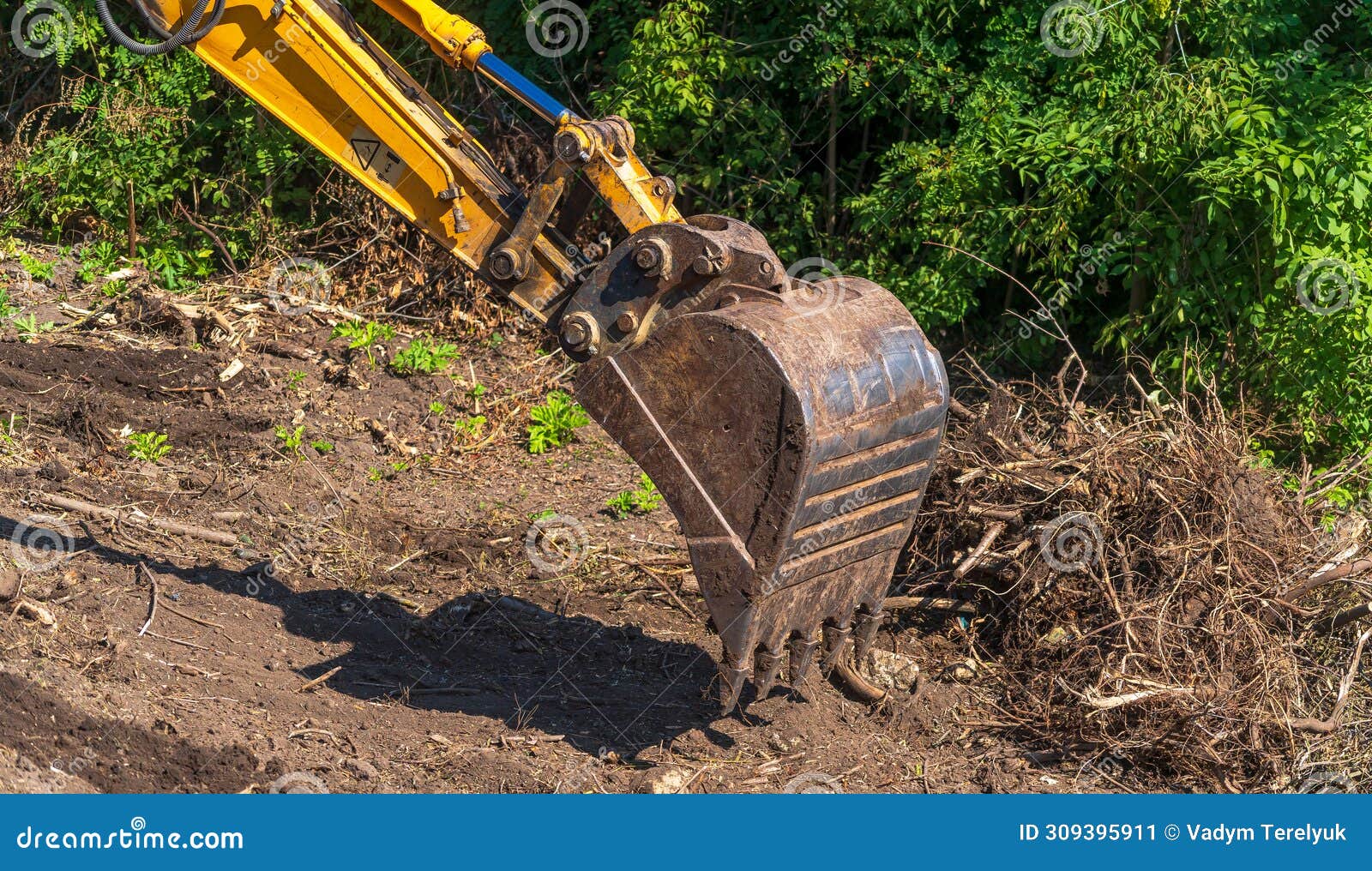 Yellow Backhoe with Hydraulic Piston Arm. Heavy Machine for Excavation