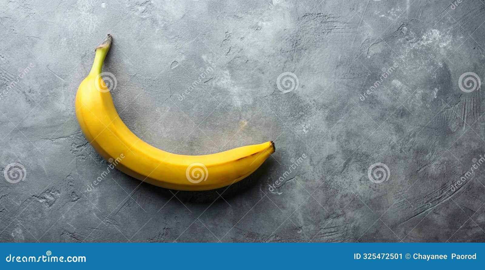 yellow banana on a grey background playful minimal food concept unique abstract flat lay idea ai-created content
