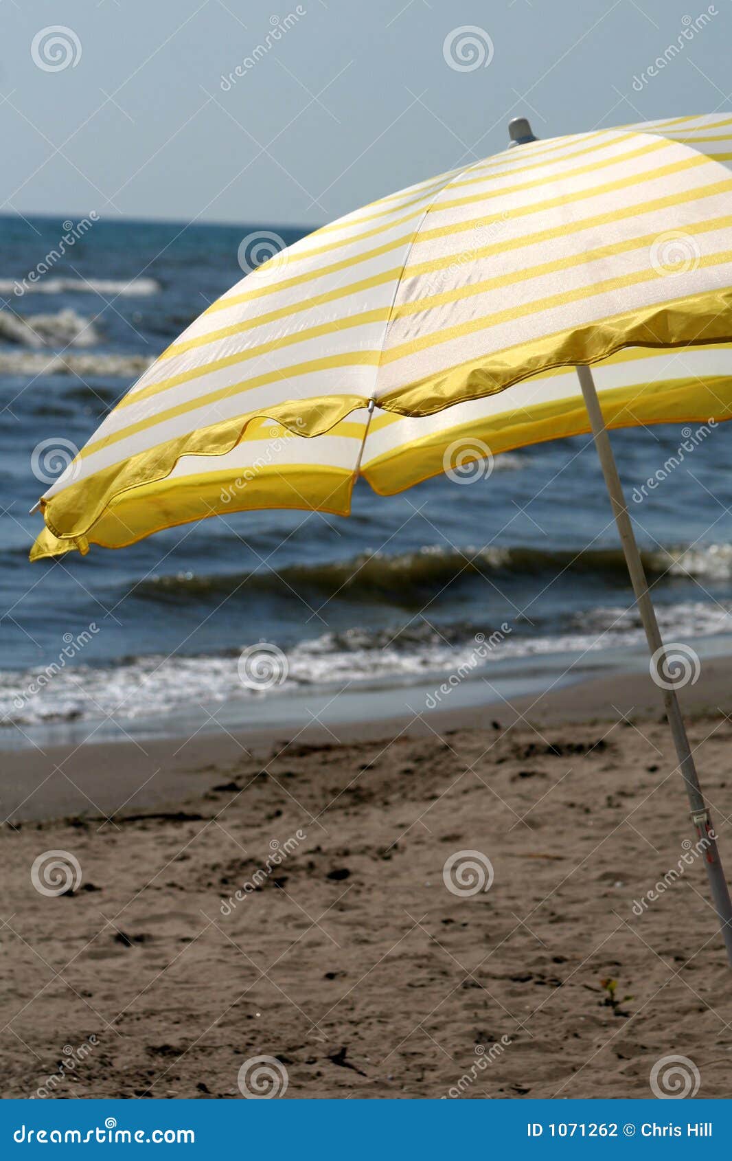 Yellow Beach Umbrella stock photo. Image of rays, swim 1071262