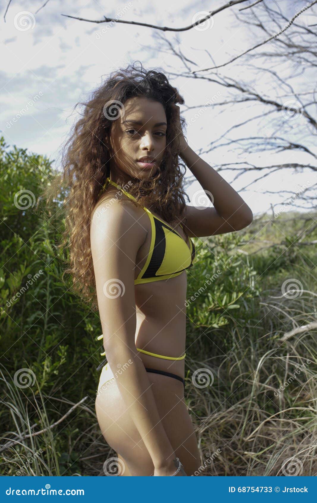 Yellow Bikini in Green Grass Stock Image Image of grass, floral 68754733