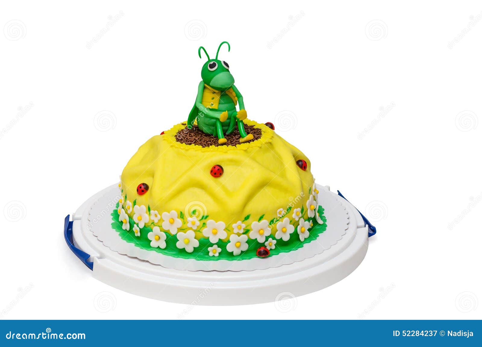 Yellow birthday cake sunflower with grasshopper. Yellow sunflower birthday cake with grasshopper and ladybird isolated on white