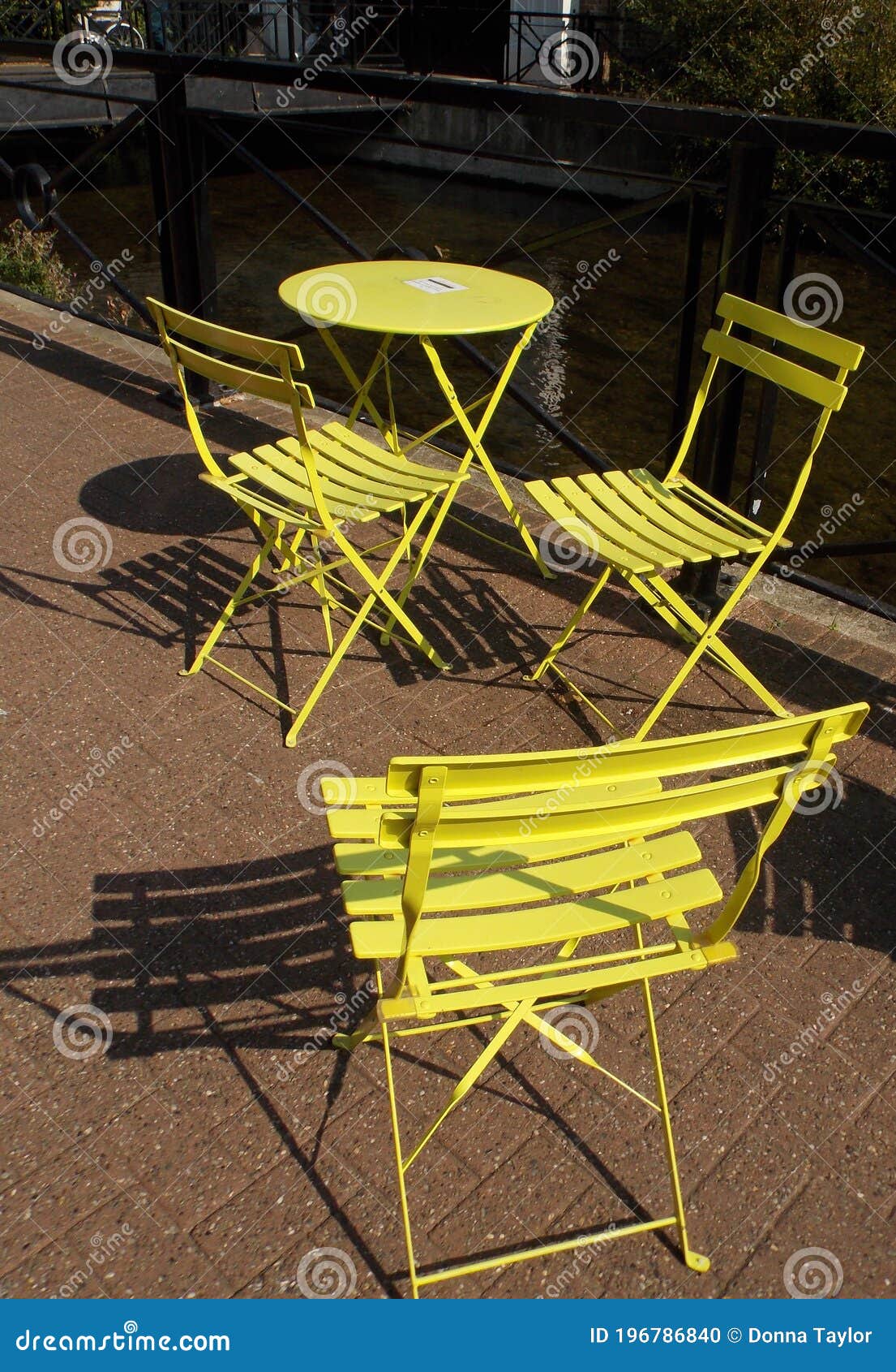 Yellow Bistro Charis and Table Stock Photo - Image of sunshine, yellow ...