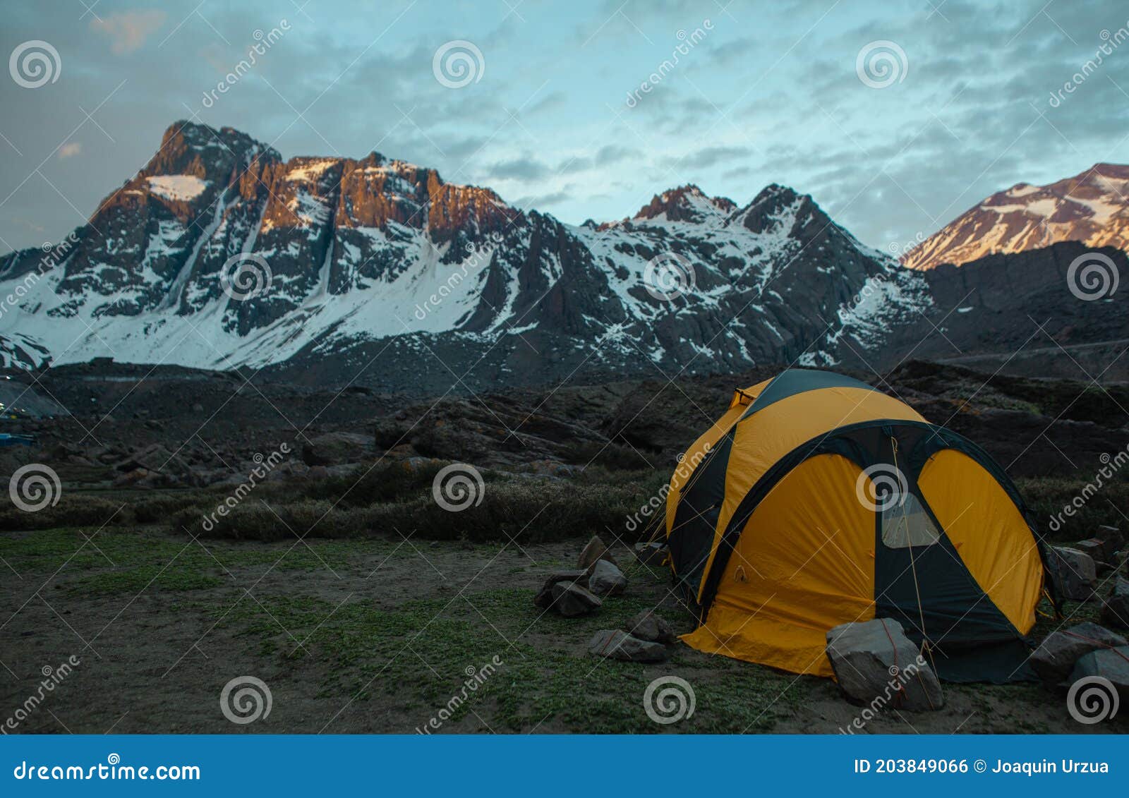 tent in the mountain during the sunrise