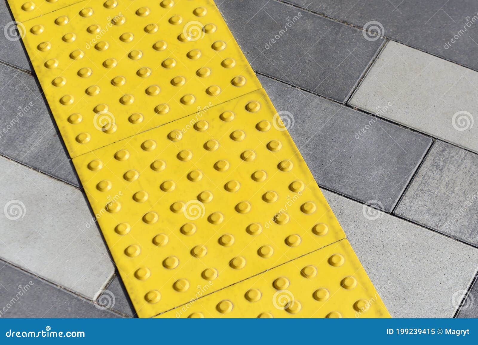 yellow blocks of tactile paving for blind handicap. braille blocks, tactile tiles for the visually impaired, tenji blocks.