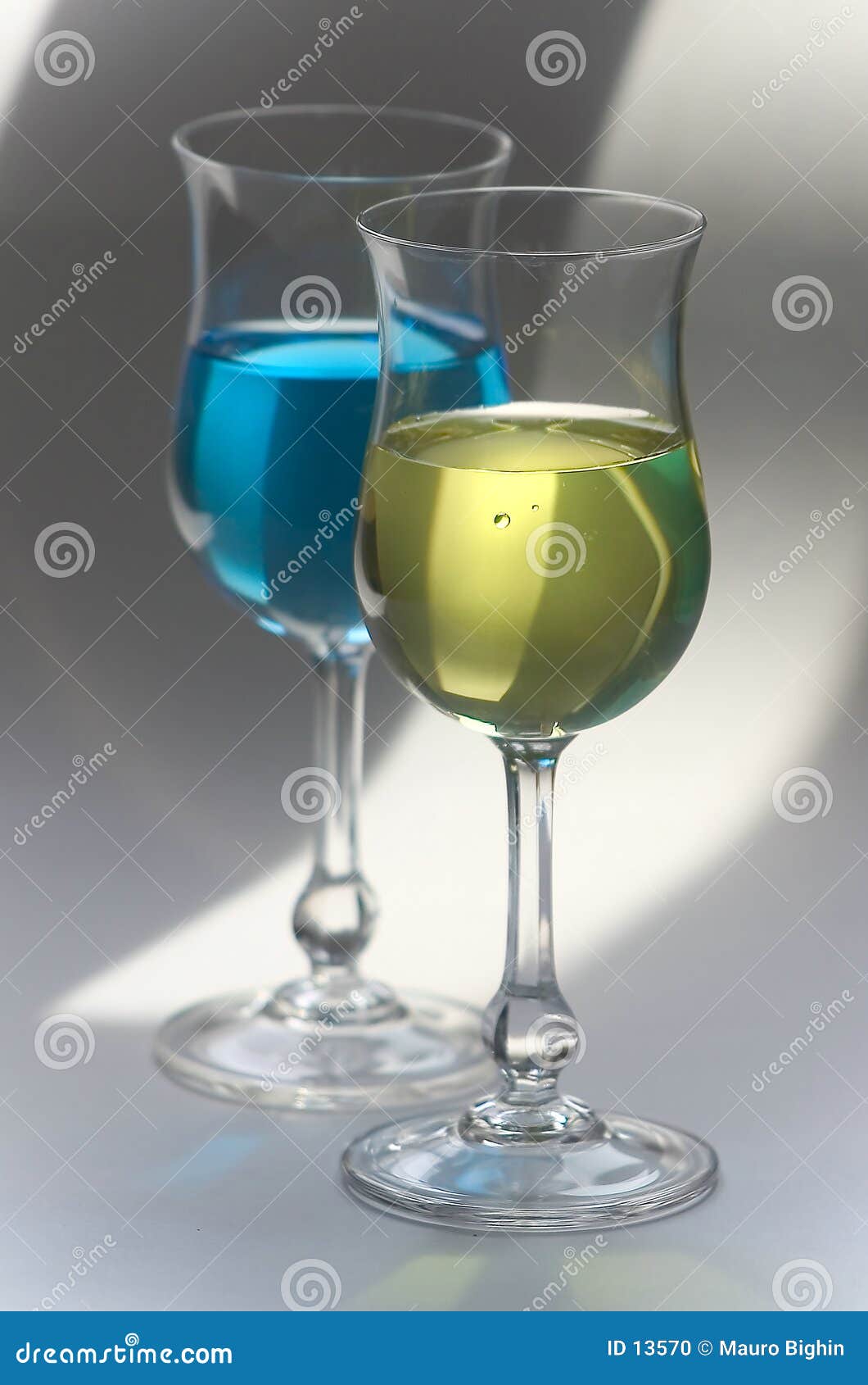 yellow and blue drinks in glasses