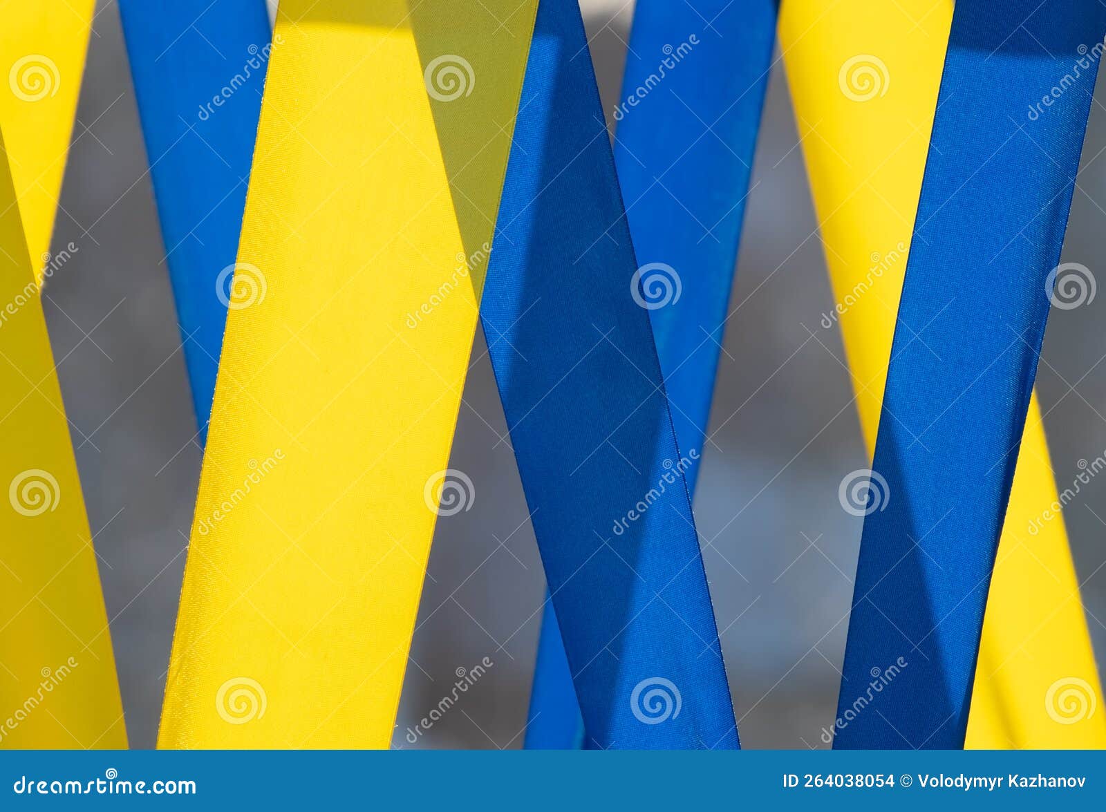 Yellow and Blue Vertical Ribbons Close-up Illuminated by the Sun Stock