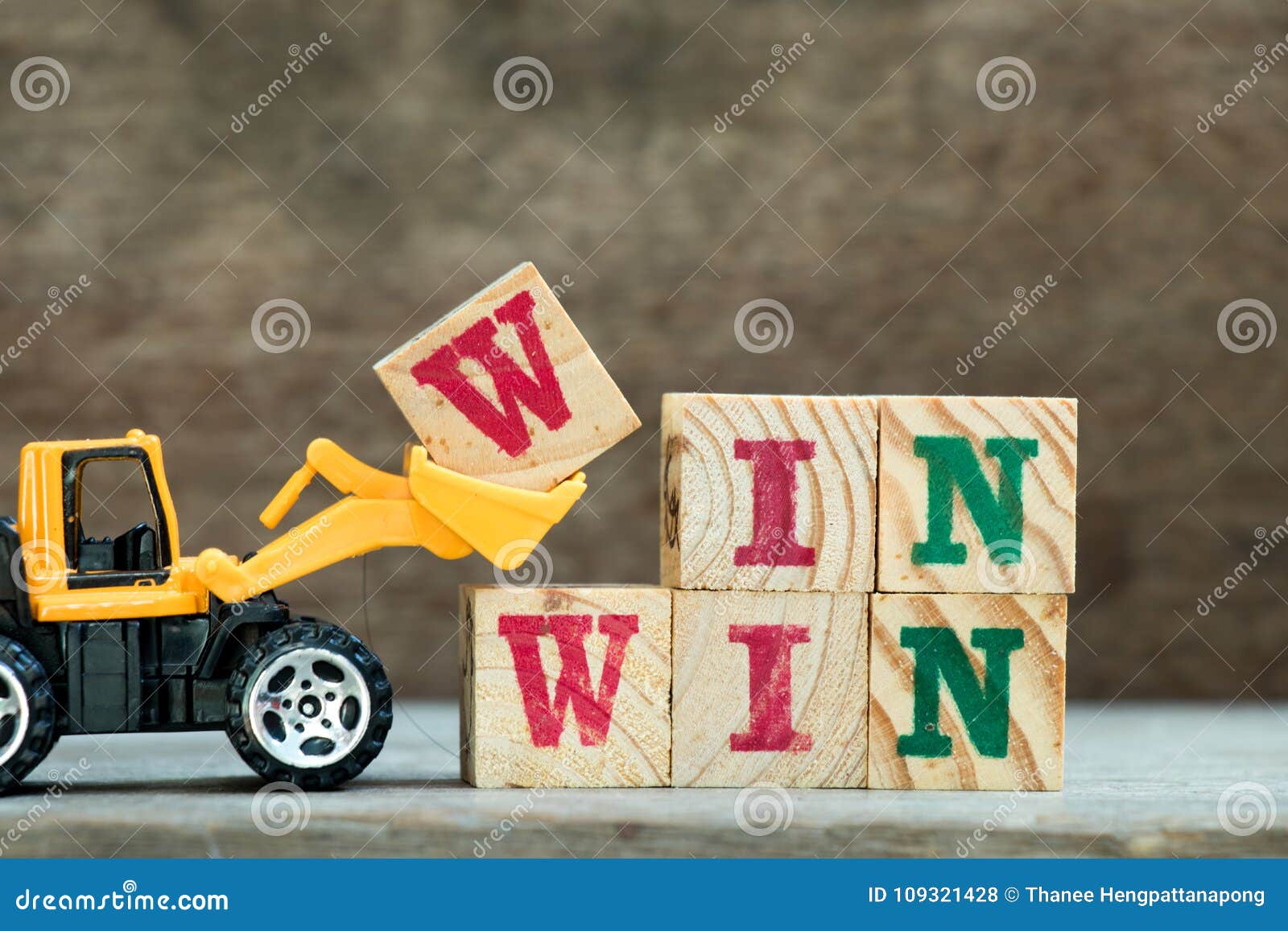 yellow bulldozer hold letter block w to word win win