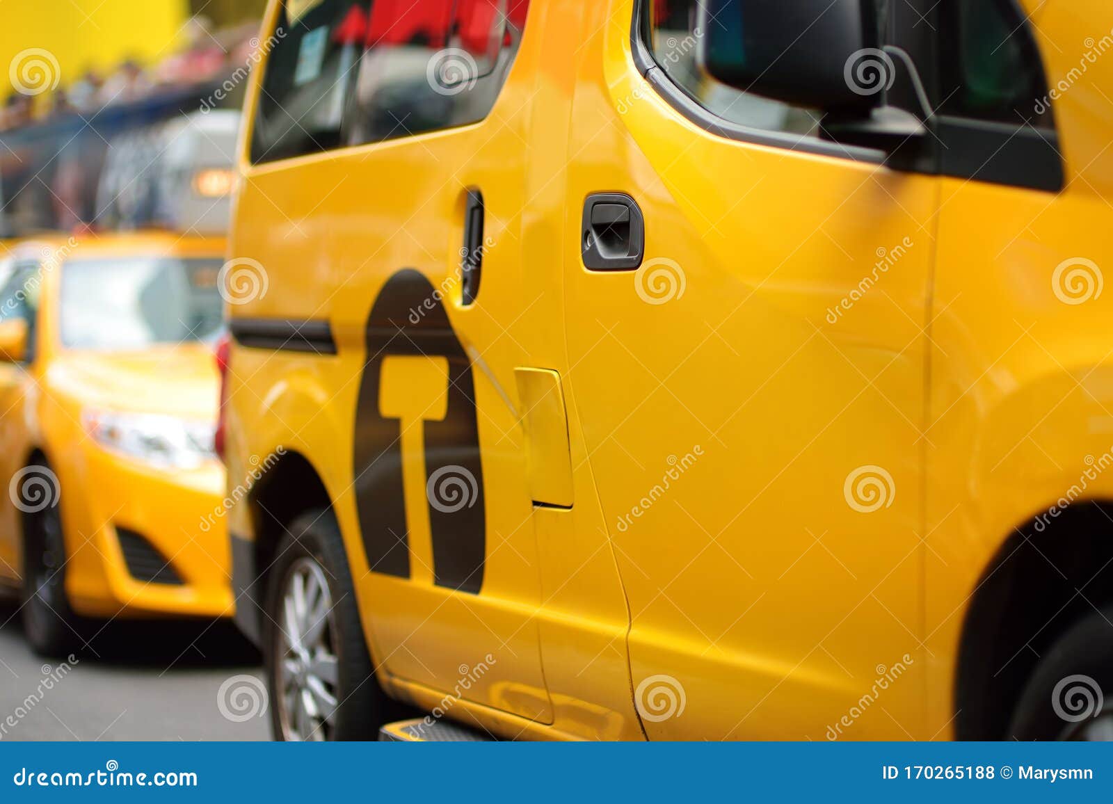yellow cab cars in traffic on times square in manhattan, new york, usa