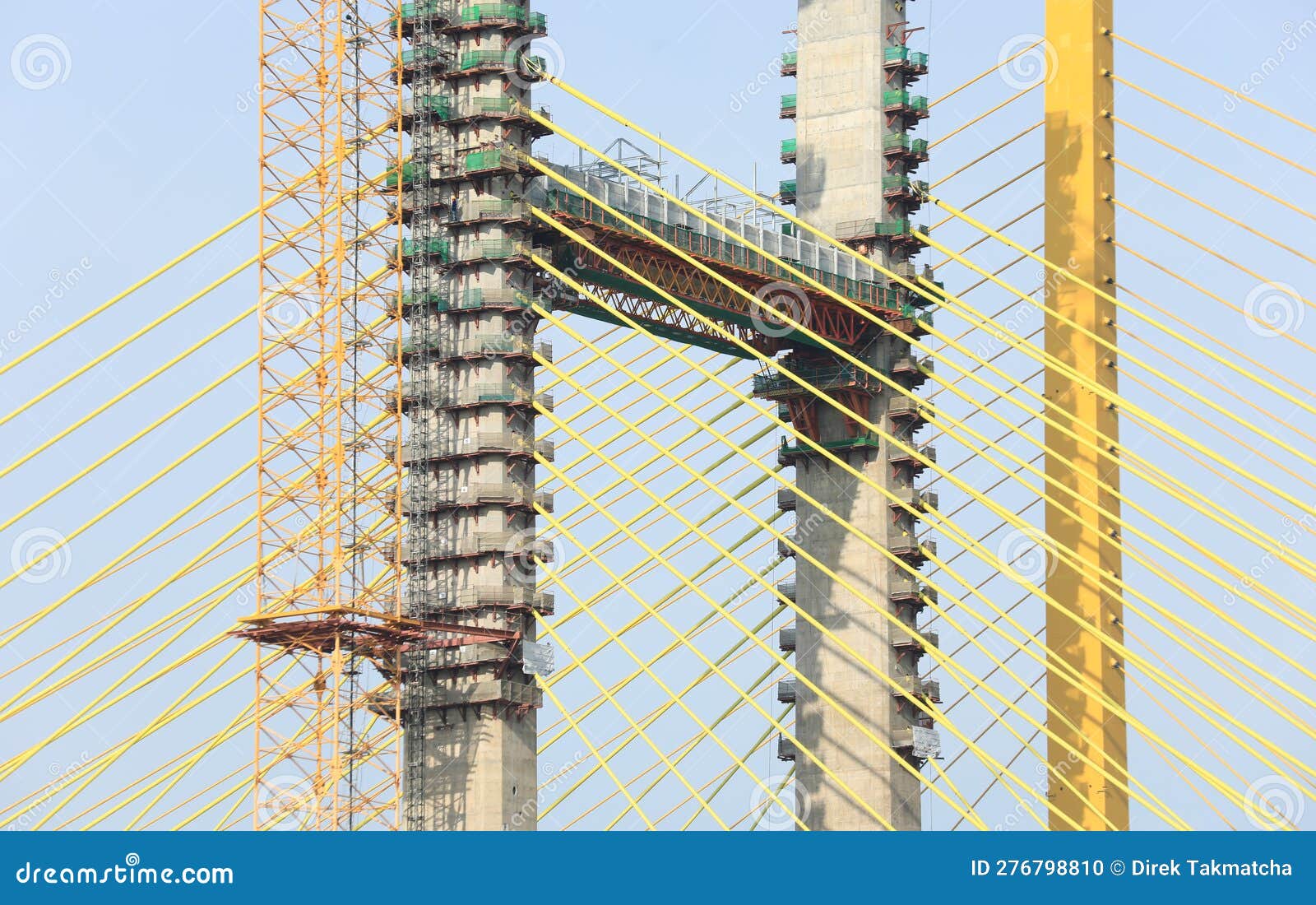 Yellow Cables of Under Construction Suspension Bridge Stock Photo