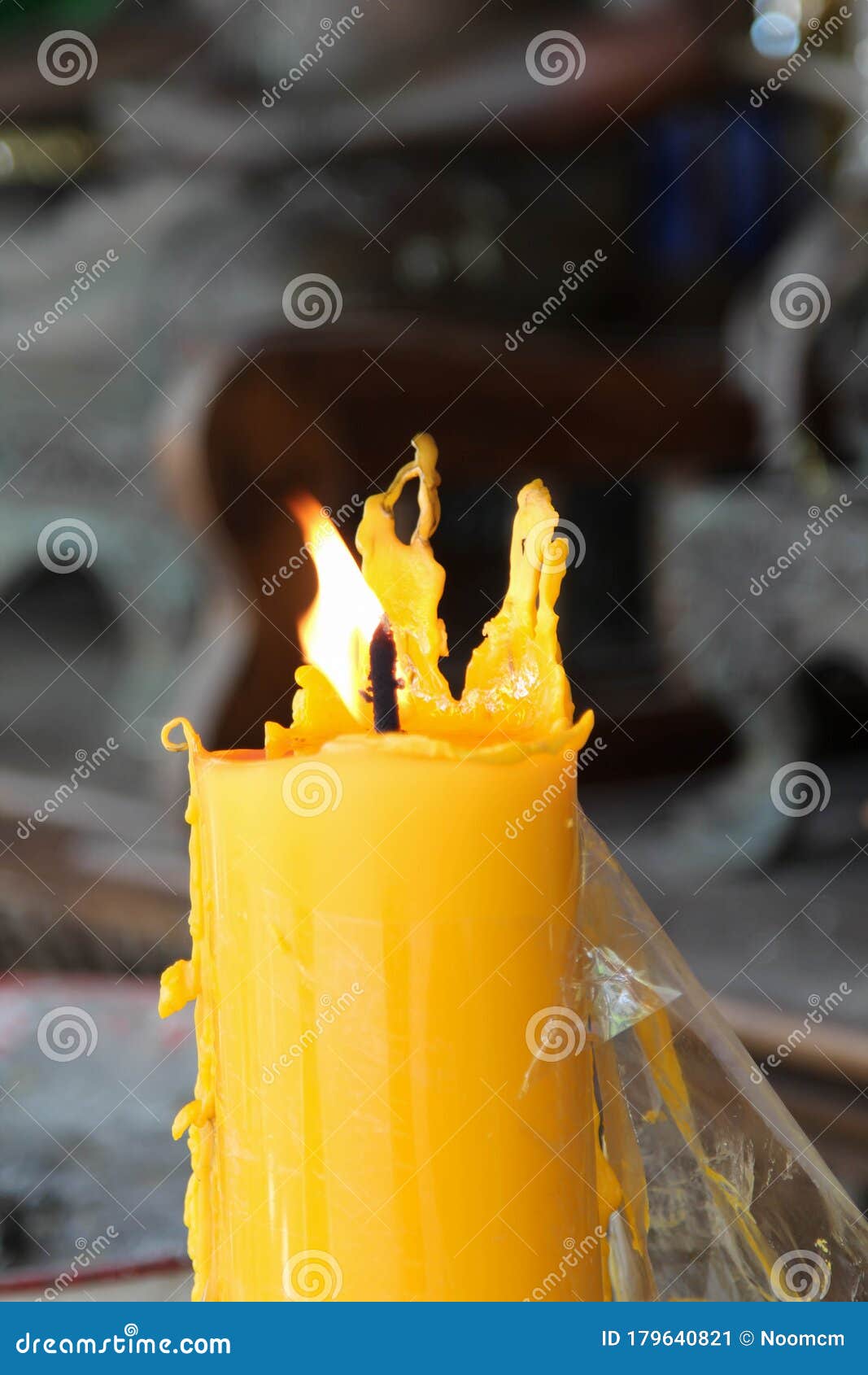 Yellow candle is burning stock image. Image of buddhism 179640821