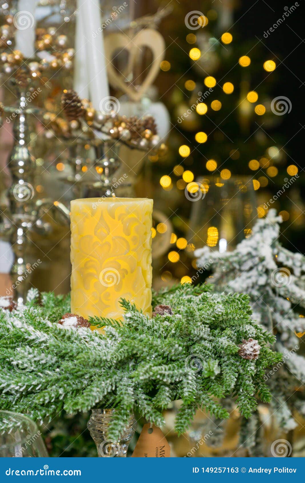 Yellow Candle Over Xmas Tree with Lights Stock Image Image of