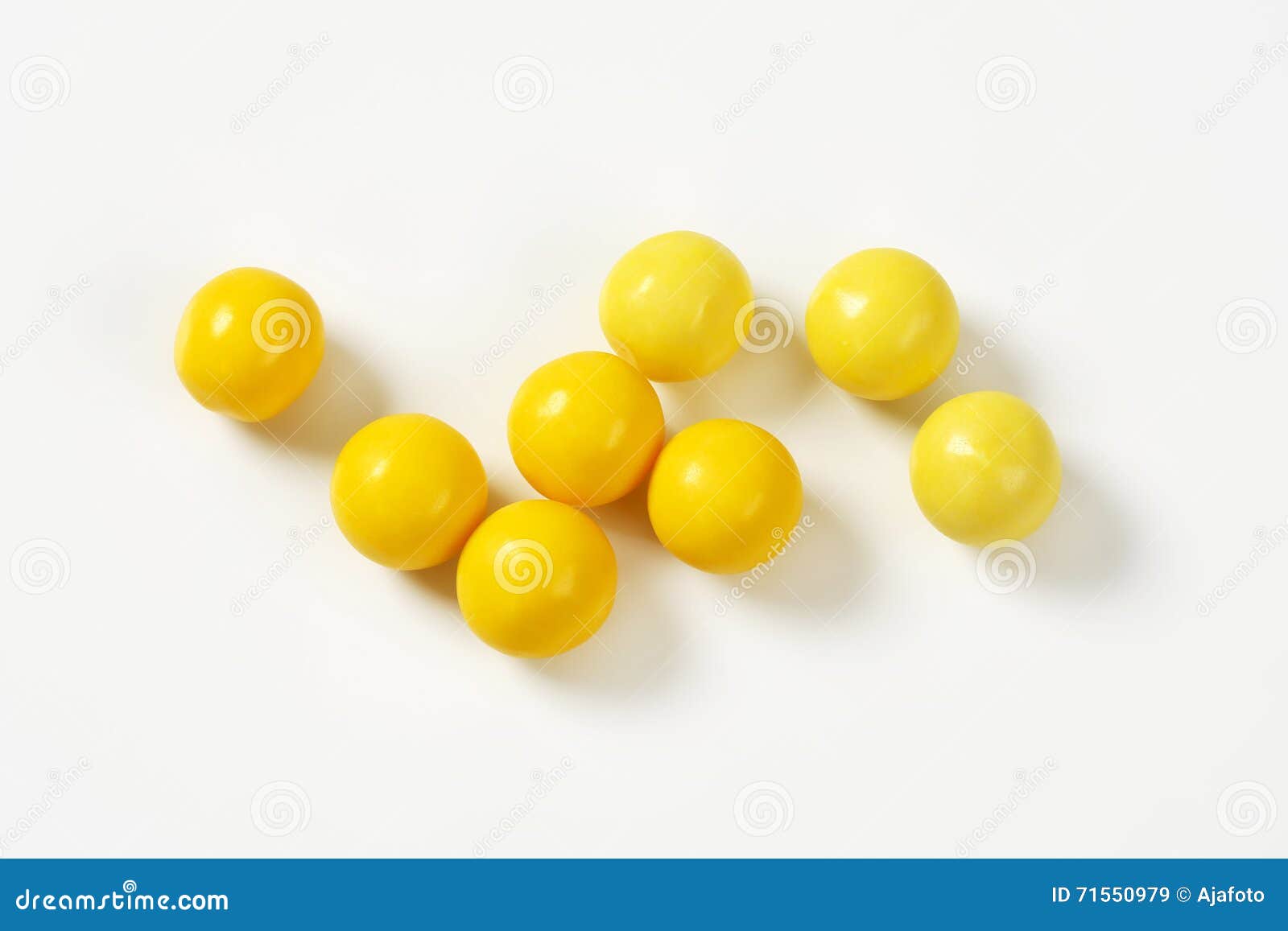 Yellow candy balls stock image. Image of group, gumballs 71550979