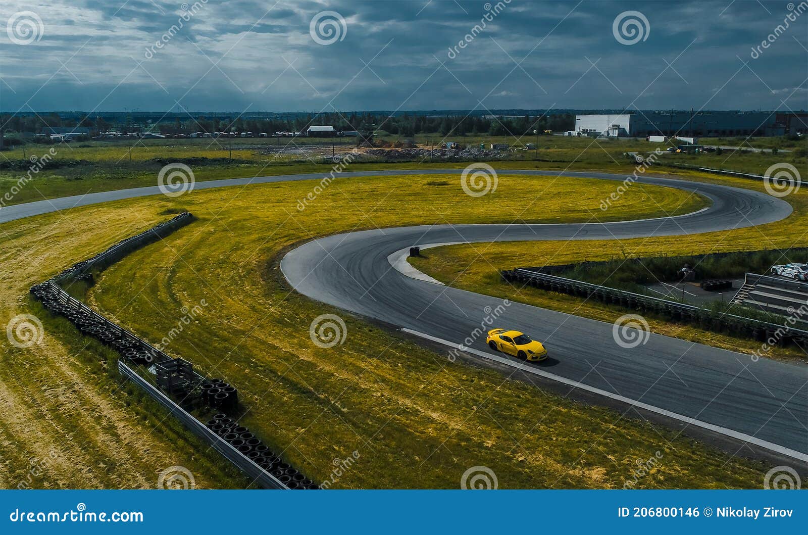 Yellow Car on the Race Track. Section of the Race Track Stock Photo