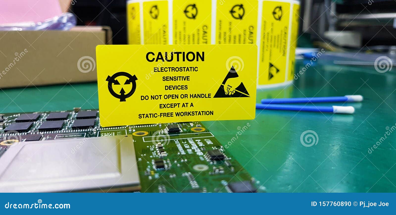 the yellow caution label for electrostatic sensitive devices esd on static free workstation