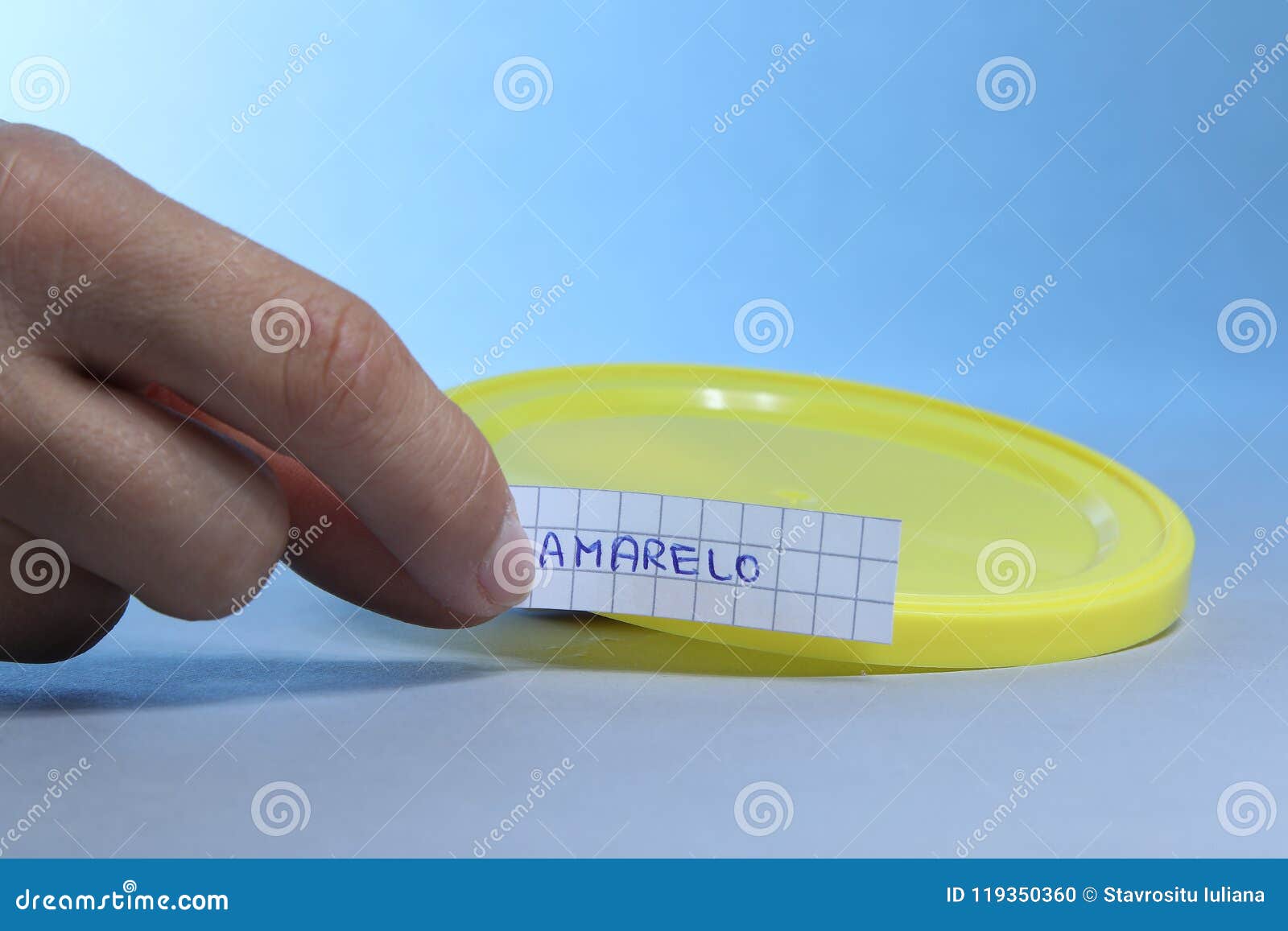 yellow lid with small blank note. amarelo the portuguese word for yellow