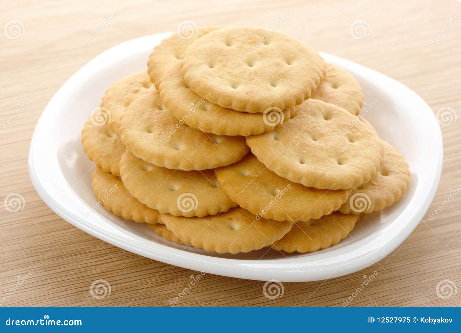 Yellow crackers on plate stock image. Image of pastry 12527975