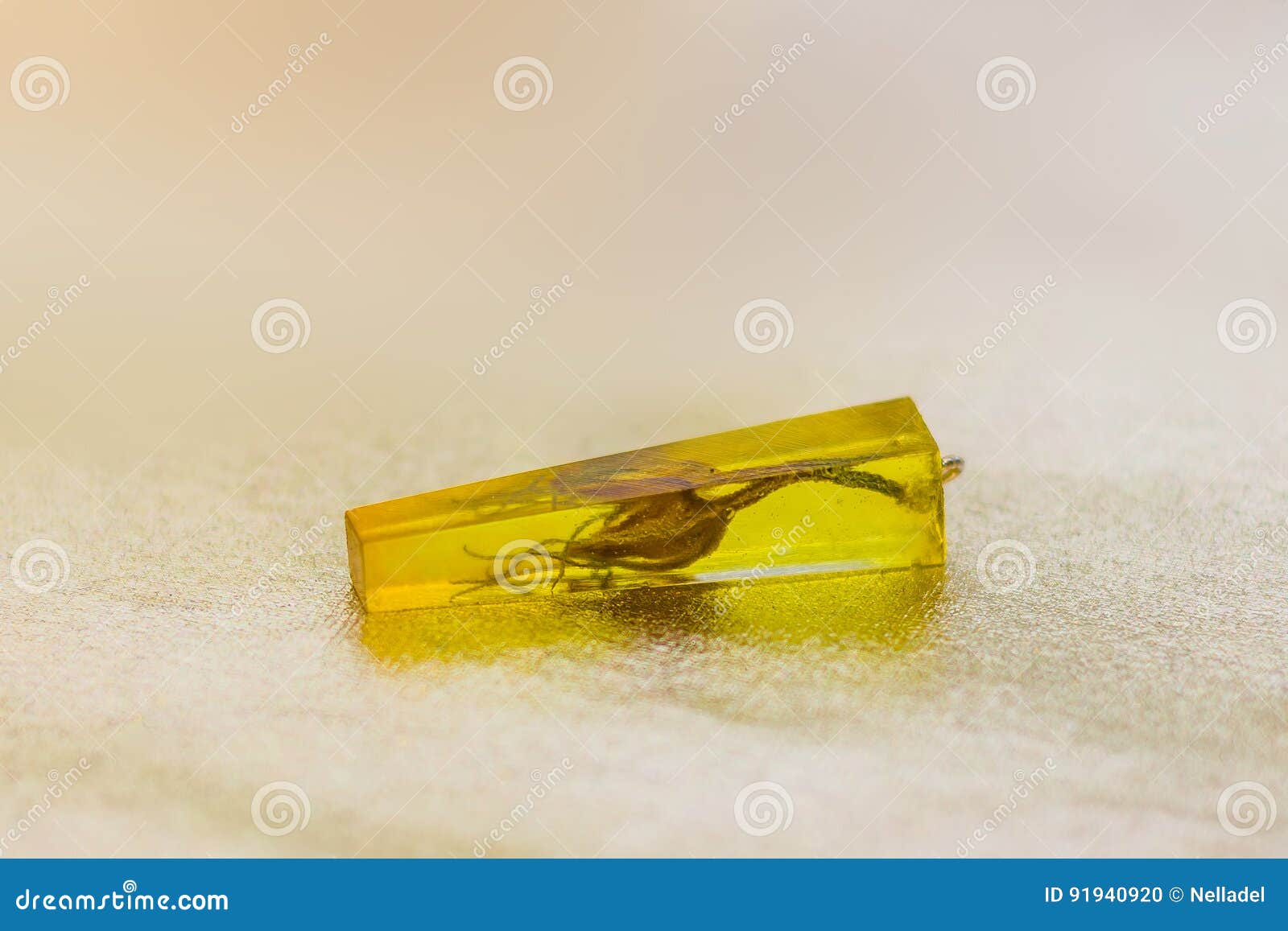 yellow crystal made of epoxy resin and flower close-up