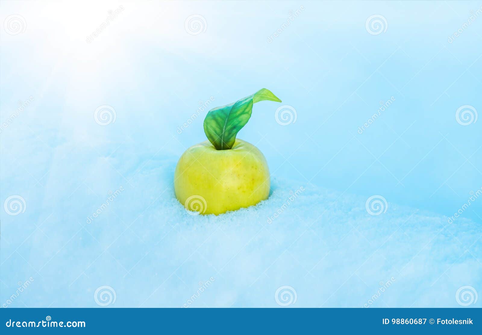 Yellow Apple in the Snow with before Christmas Stock Image - Image of ...