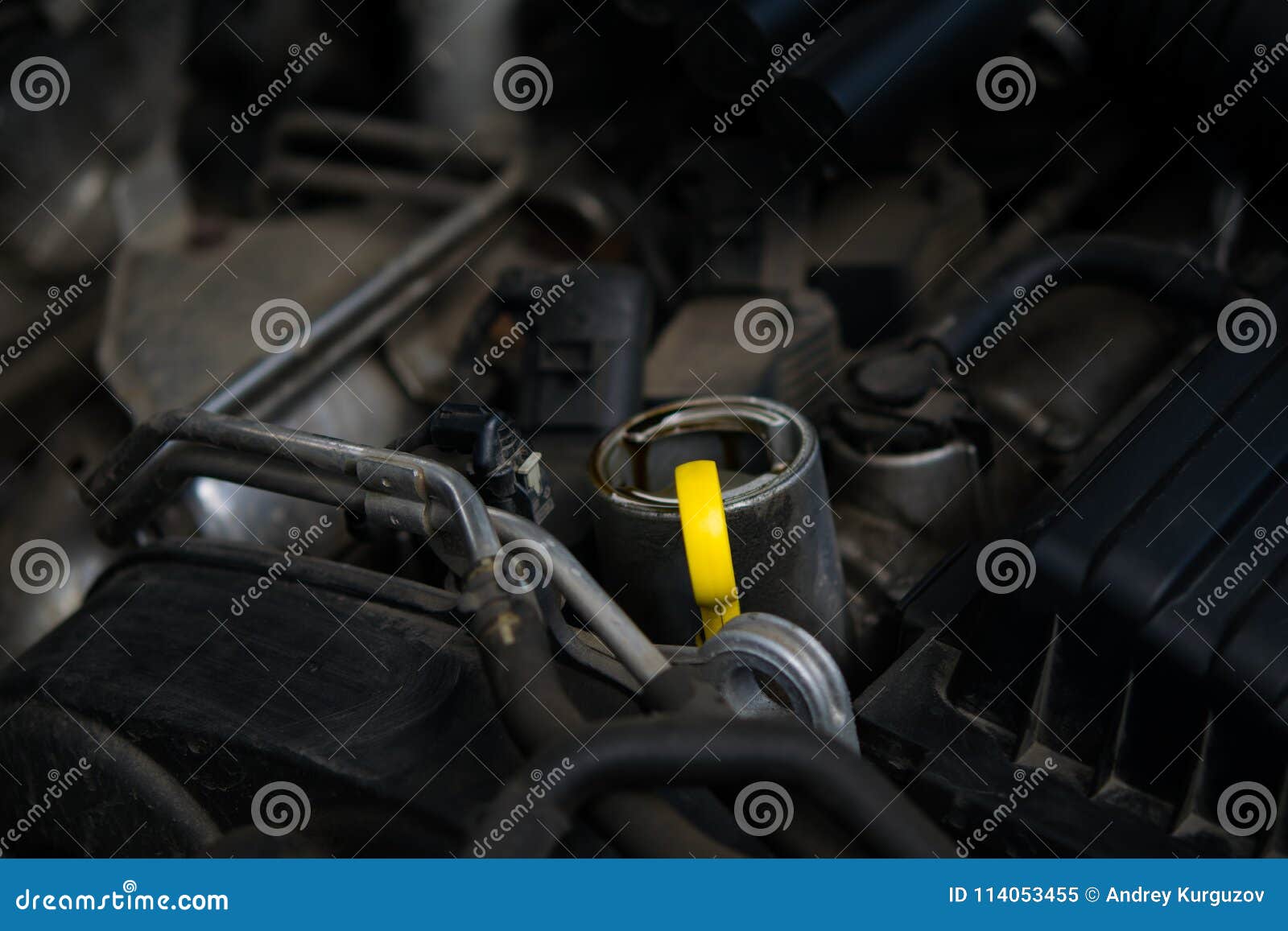 Yellow Oil Dipstick In Car Engine Measuring Level Of Engine Oil Yellow Oil Dipstick In Car Engine Measuring Level Of Engine Oil