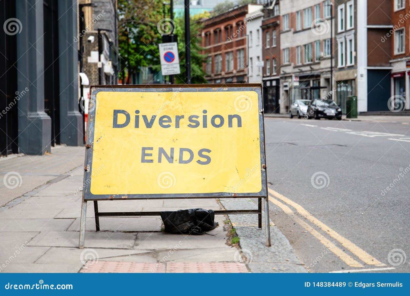 yellow diversion ends road sign in a uk city street