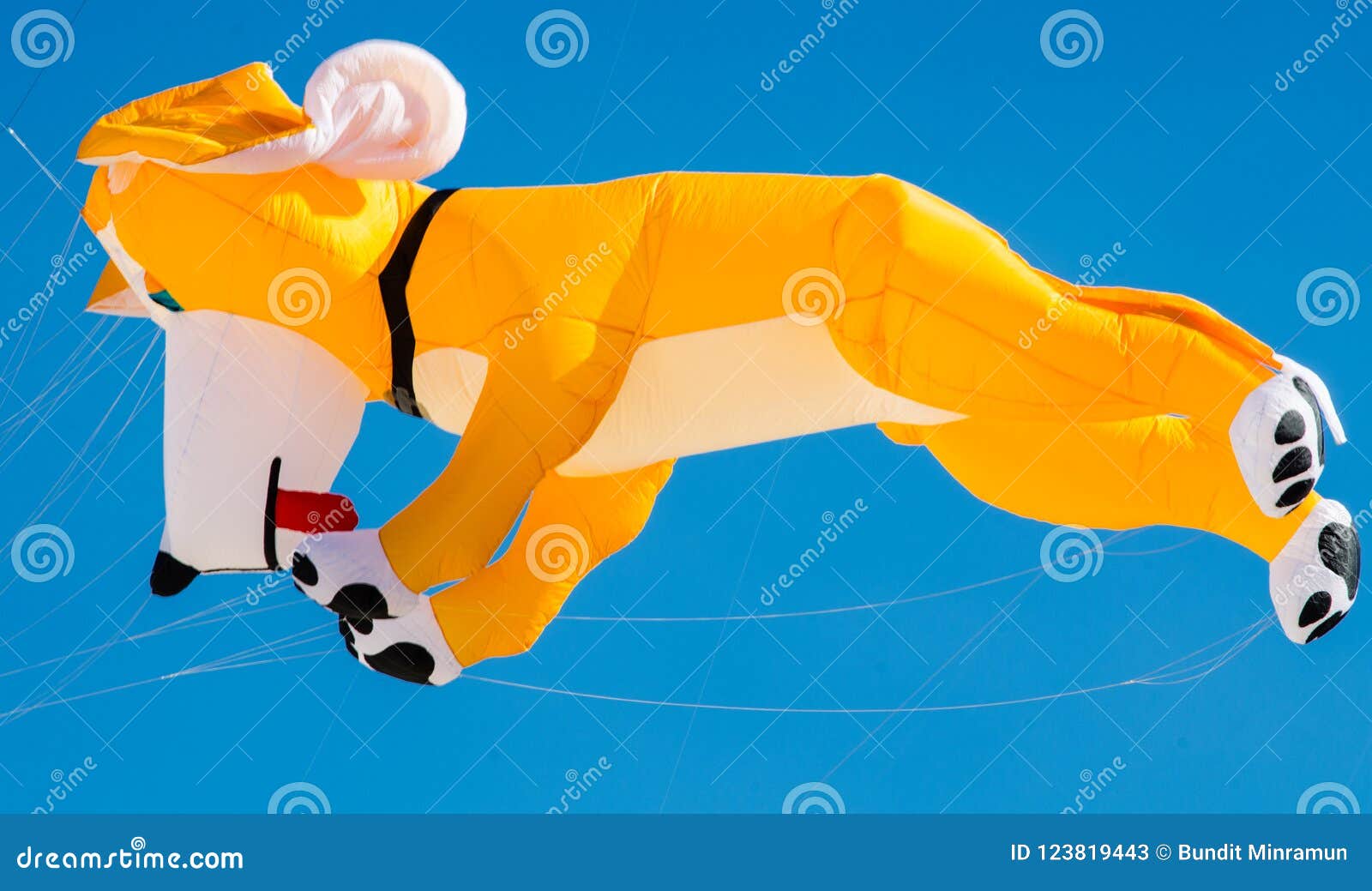 Yellow Dog Kite Design Flying on Blue Sky. Stock Image Image of puppy