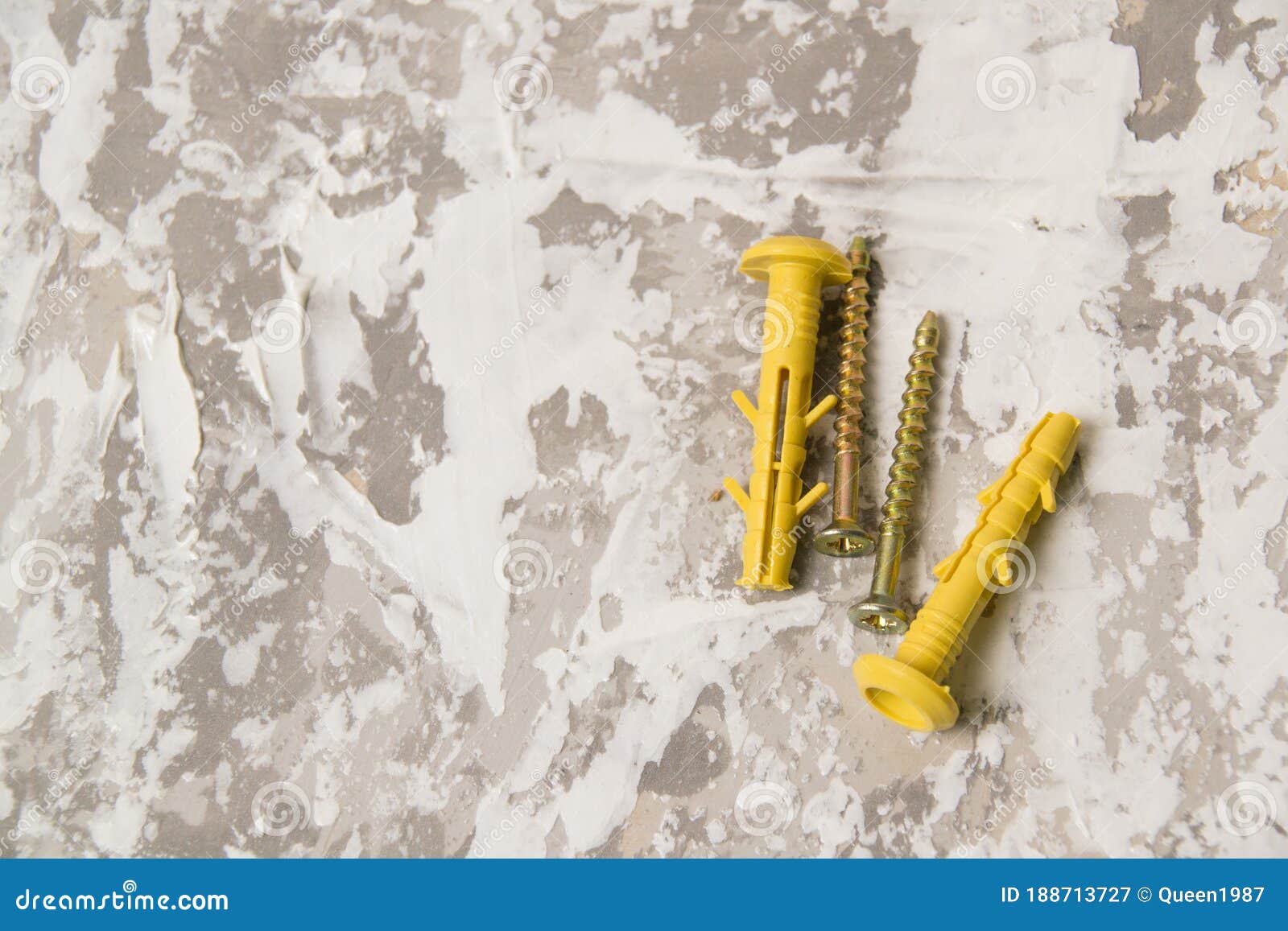 yellow dowels on white-gray putty background with place for text insertion