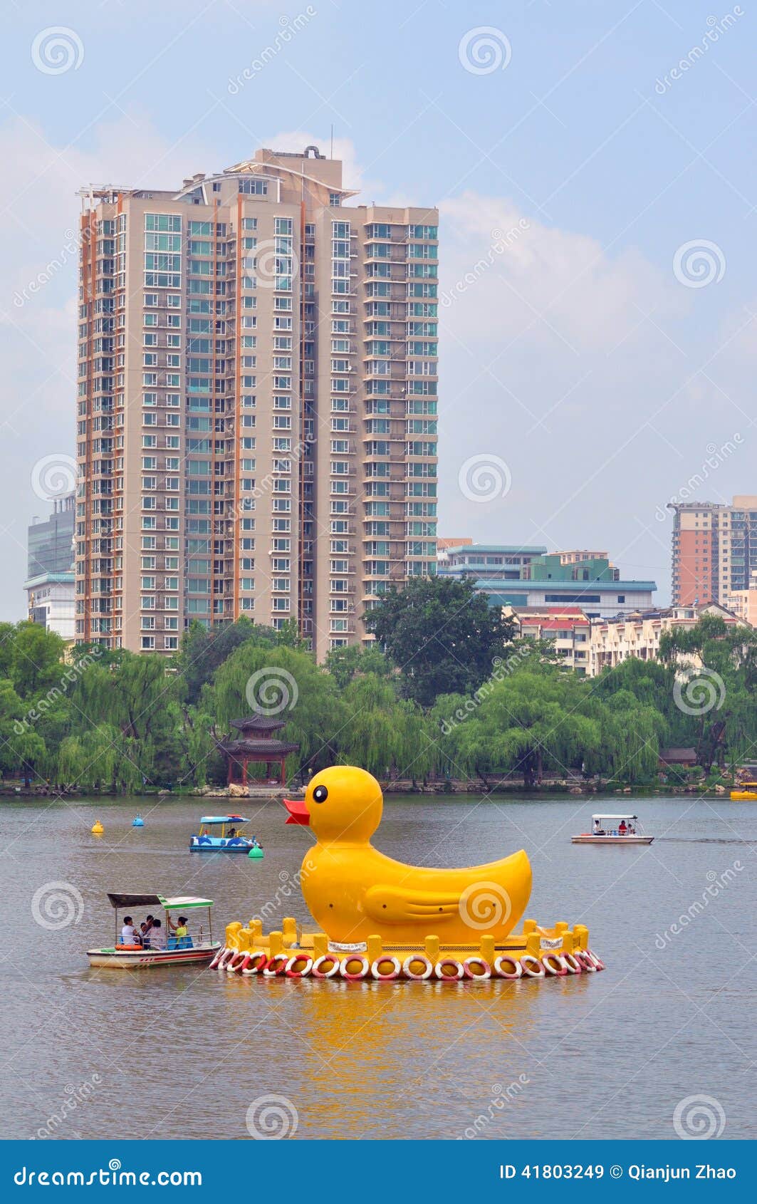 yellow ducks in black bamboo park in beijing editorial