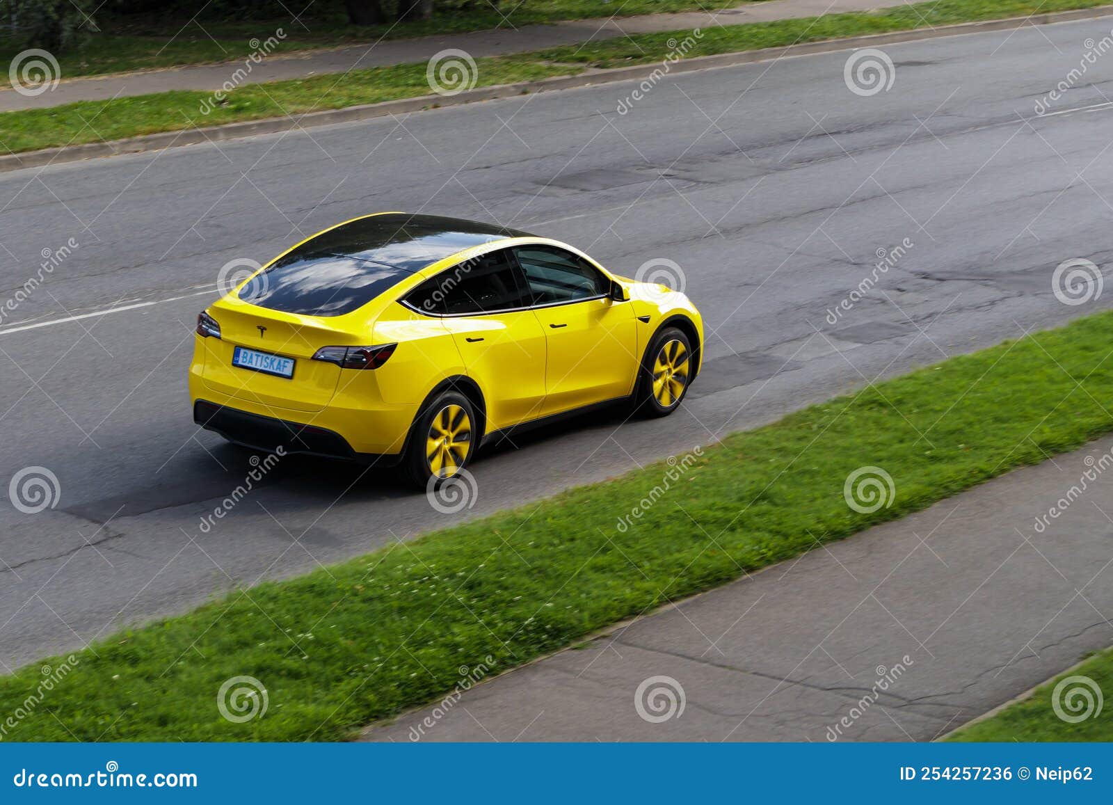 A Yellow Electric Car Is Driving Down The Street. Yellow Tesla Model X  Editorial Photo - Image Of Energy, Design: 254257236