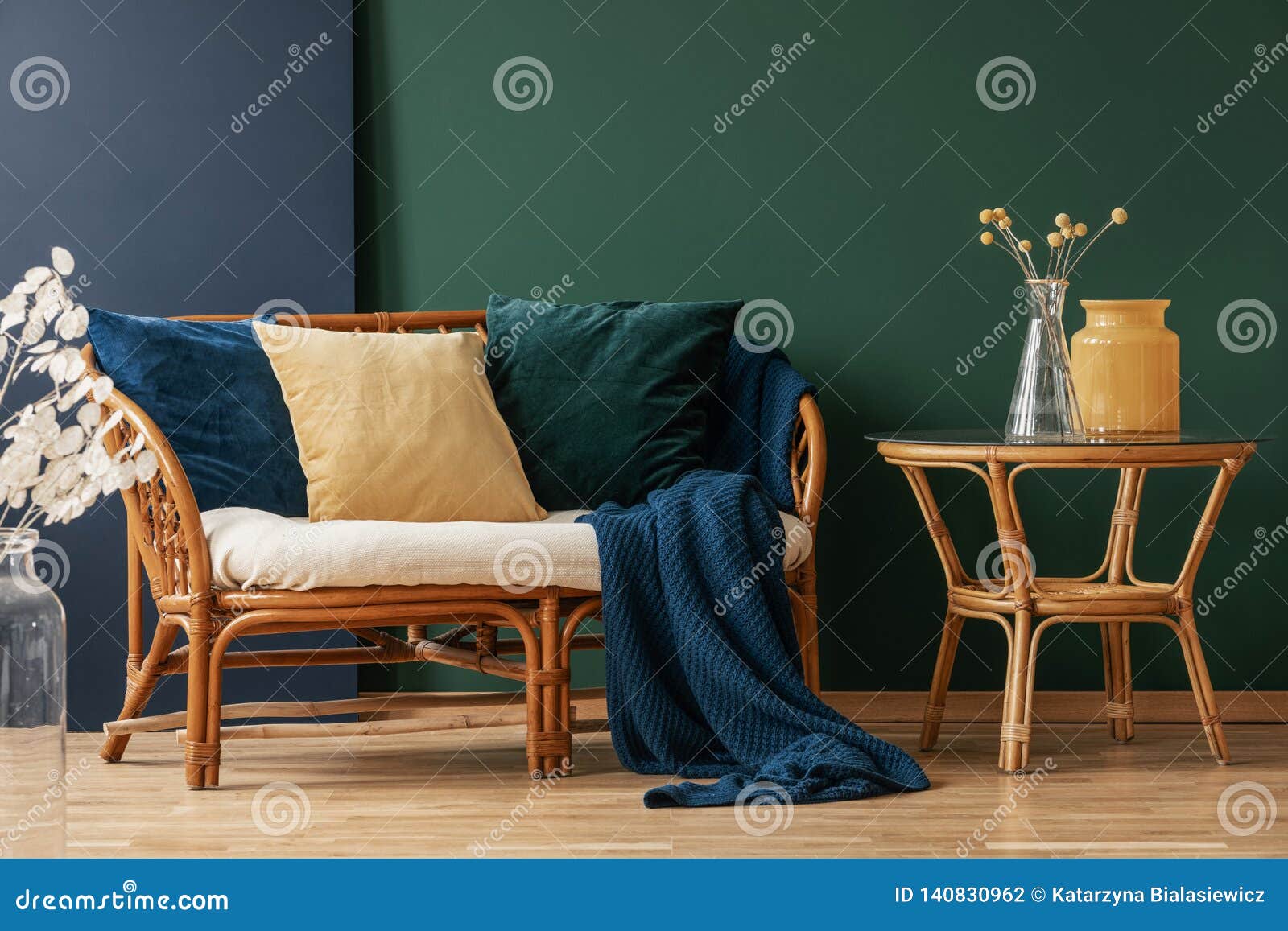 Yellow, Emerald Green and Blue Pillows on Rattan, Copy Space on the