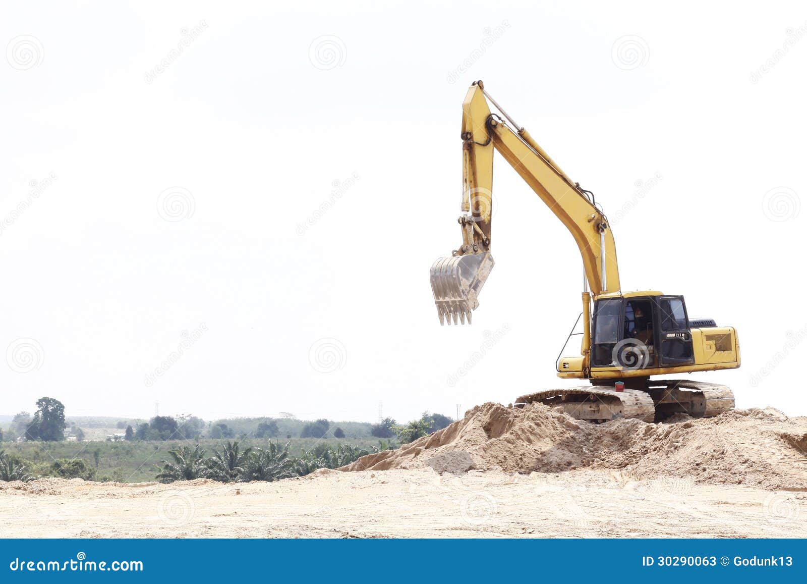 Excavator on sand pile stock image. Image of heavy, tractor 30290063