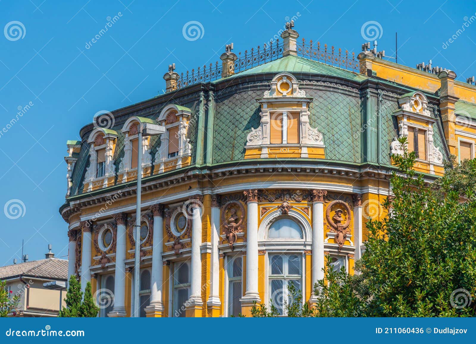 yellow facade of modello palace at rijeka, croatia