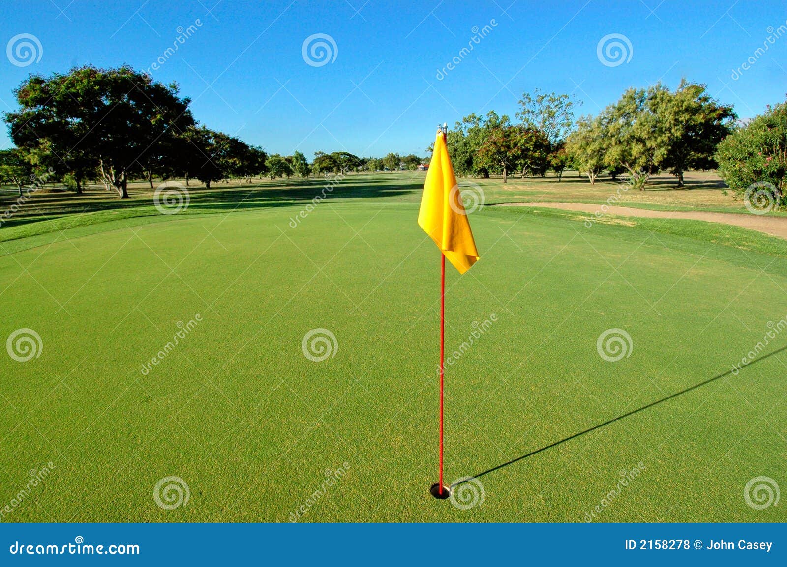 Yellow flag on golf green stock photo. Image of recreation 2158278