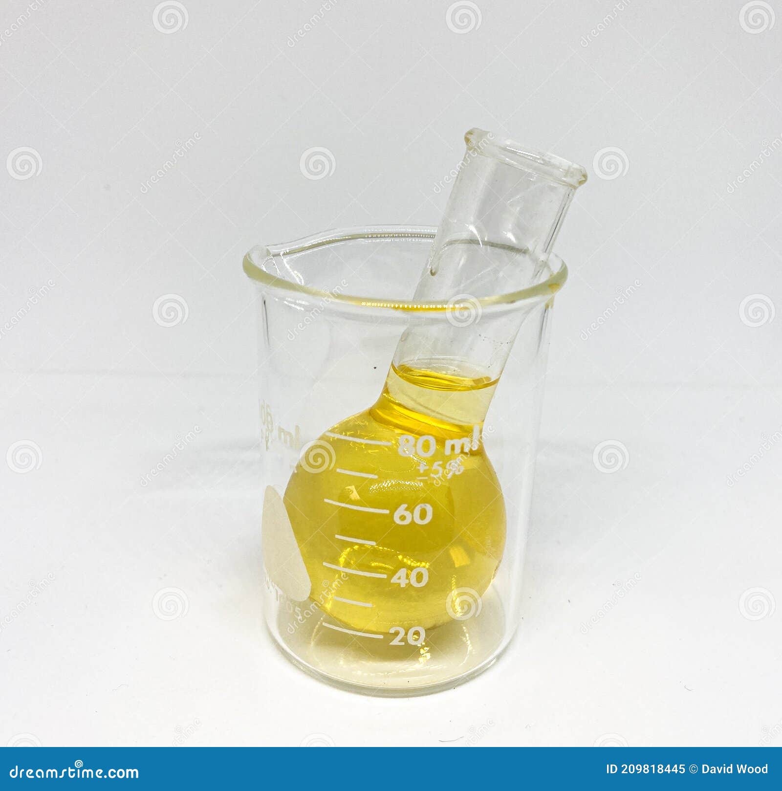Yellow Fluid in Glassware Beaker with White Background Stock Image
