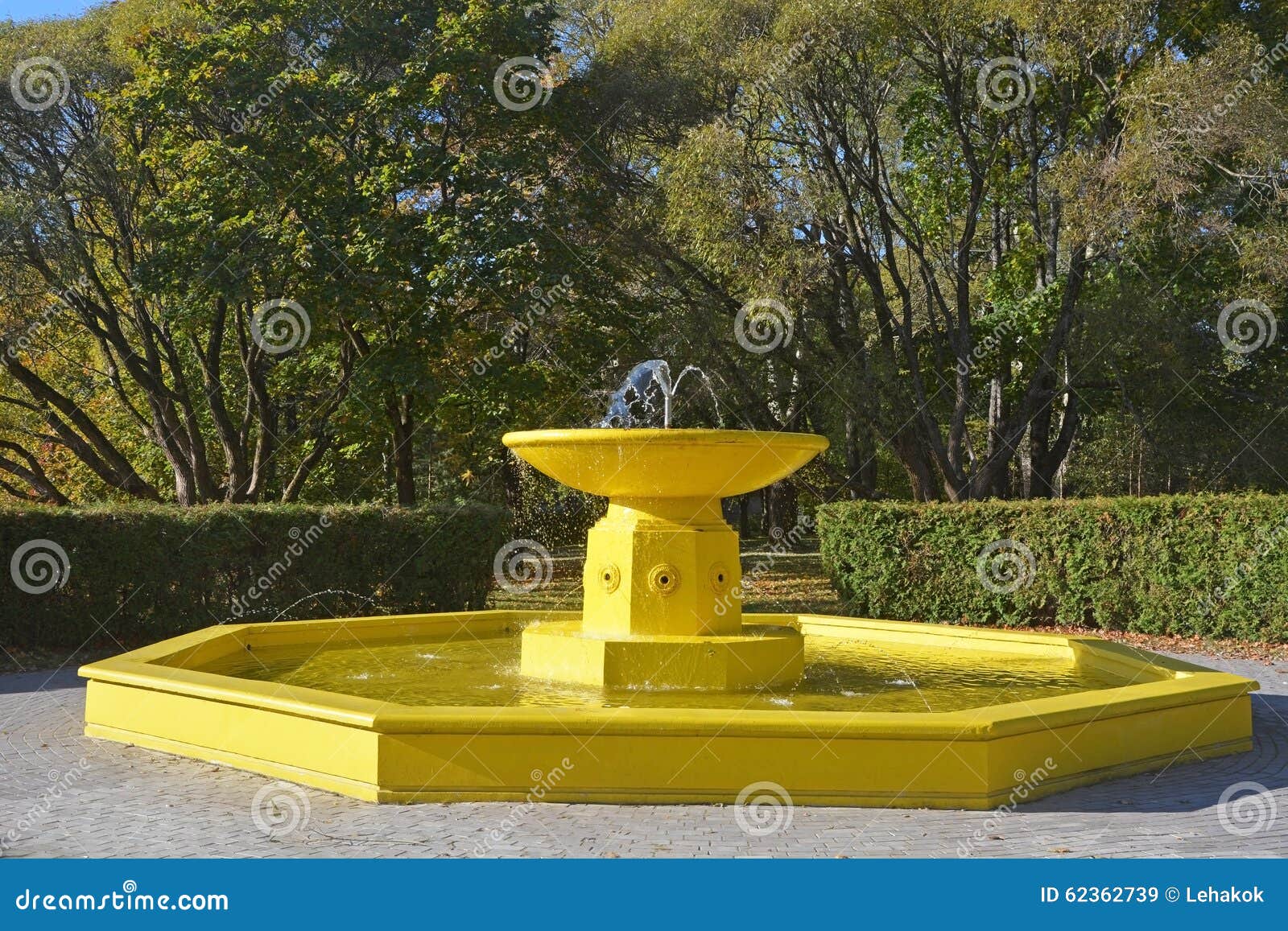 Yellow fountain stock image. Image of flow, background 62362739